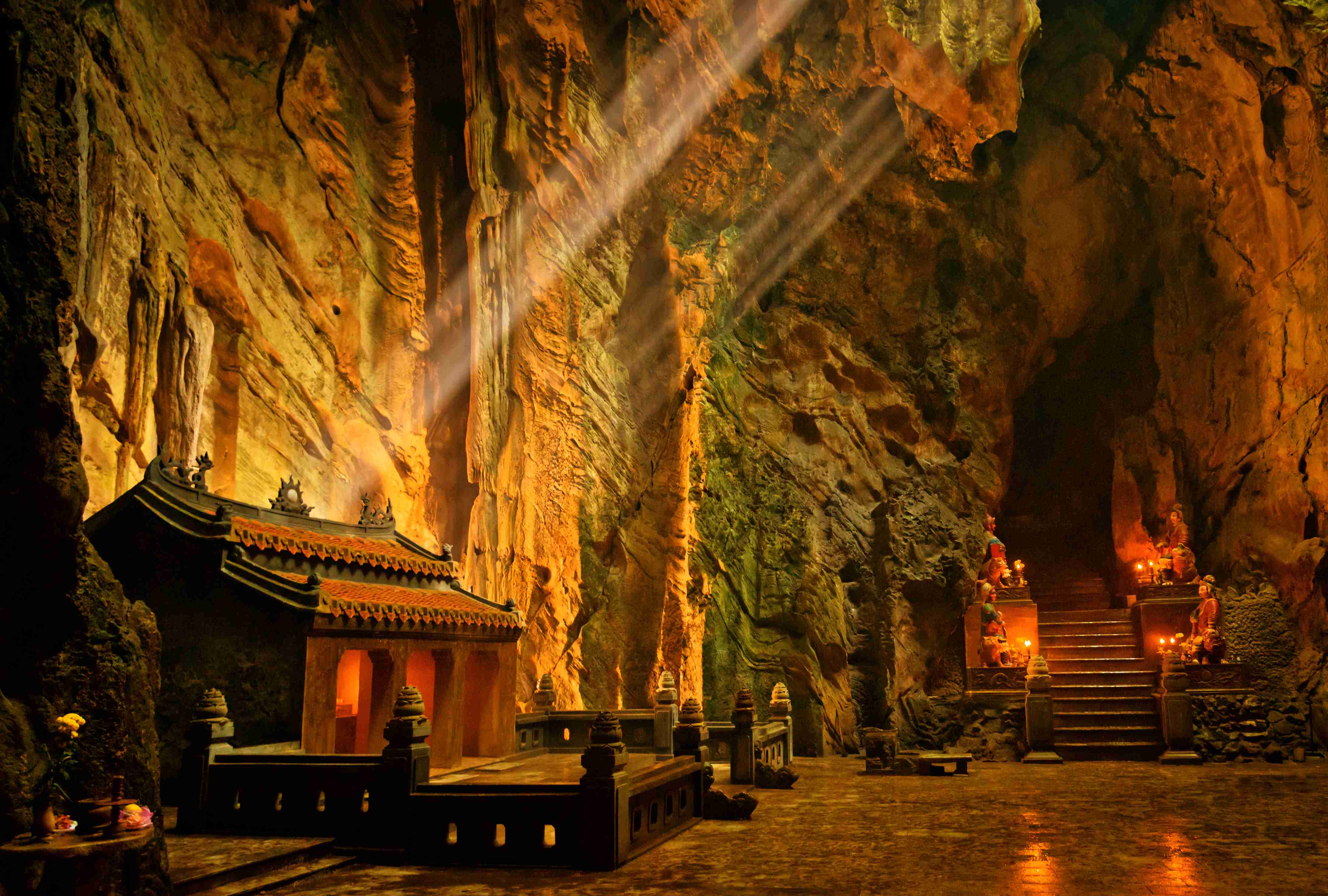Dark cave with mystical Troglodyte temple, Huyen Khong grotto, Marble Mountains