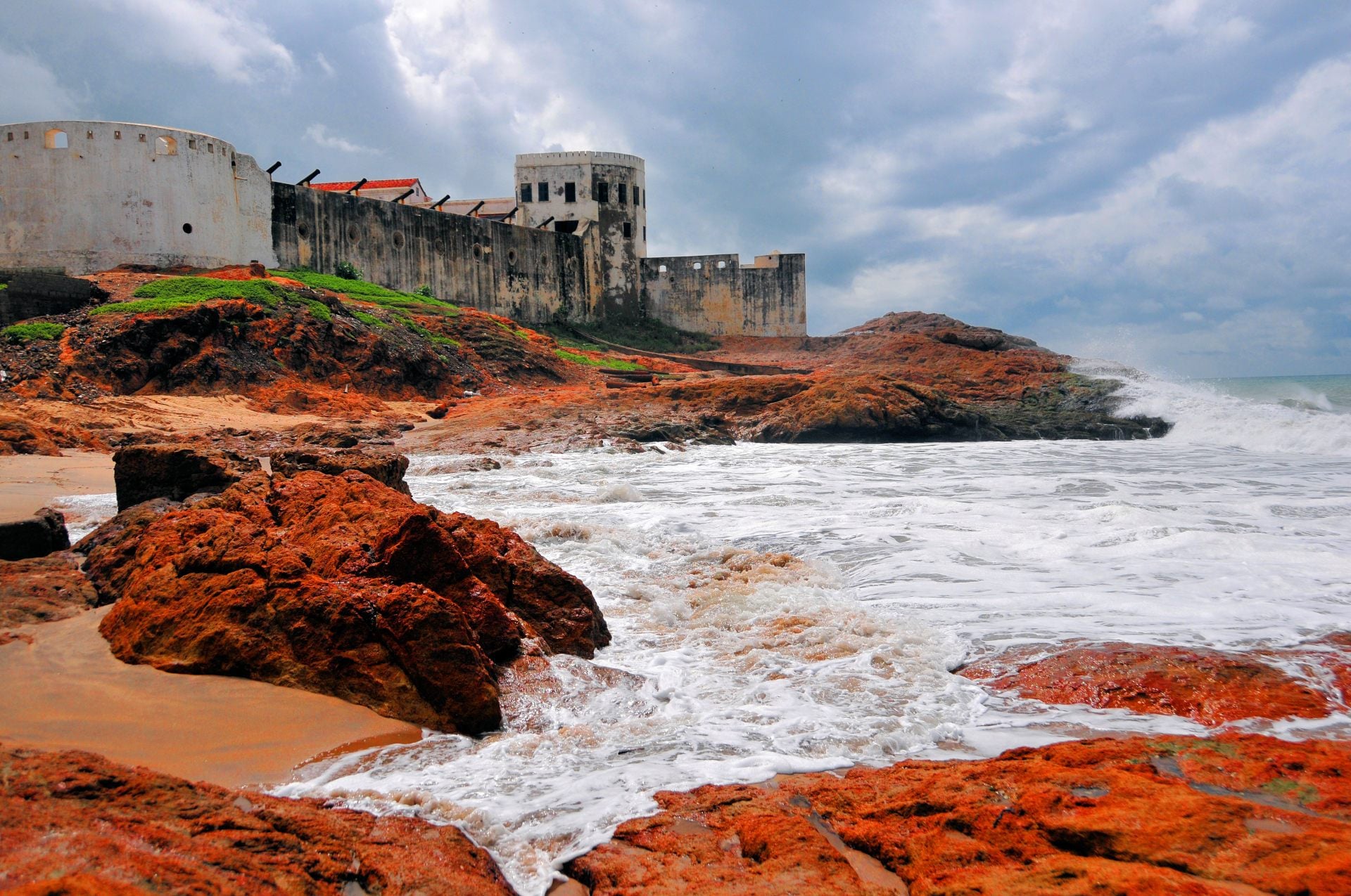 Cape Coast castle, the ocean and red rocks