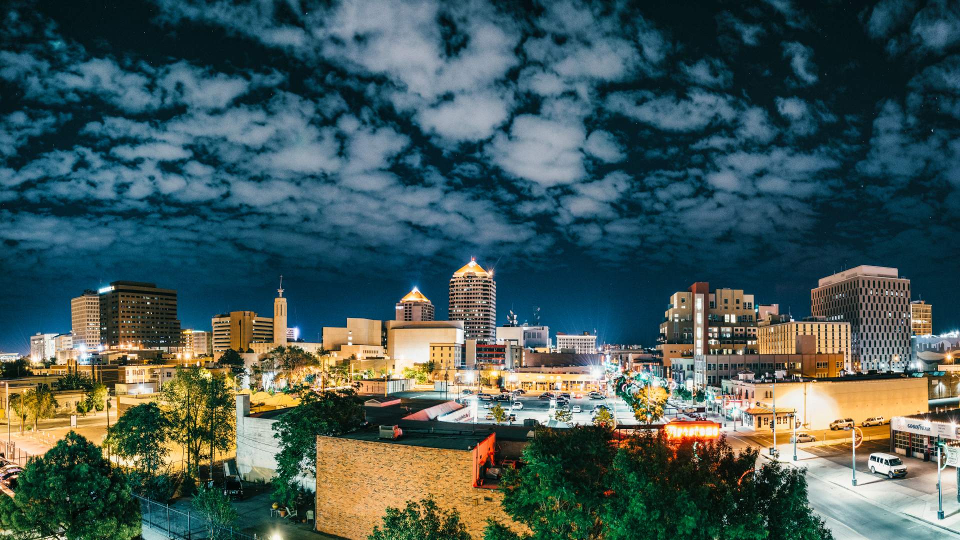Panoramic image of city skyline at night.