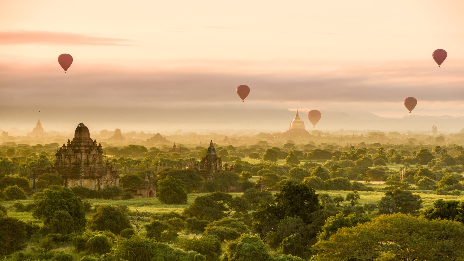 Hot air balloons dot the morning sky in Bagan, Myanmar