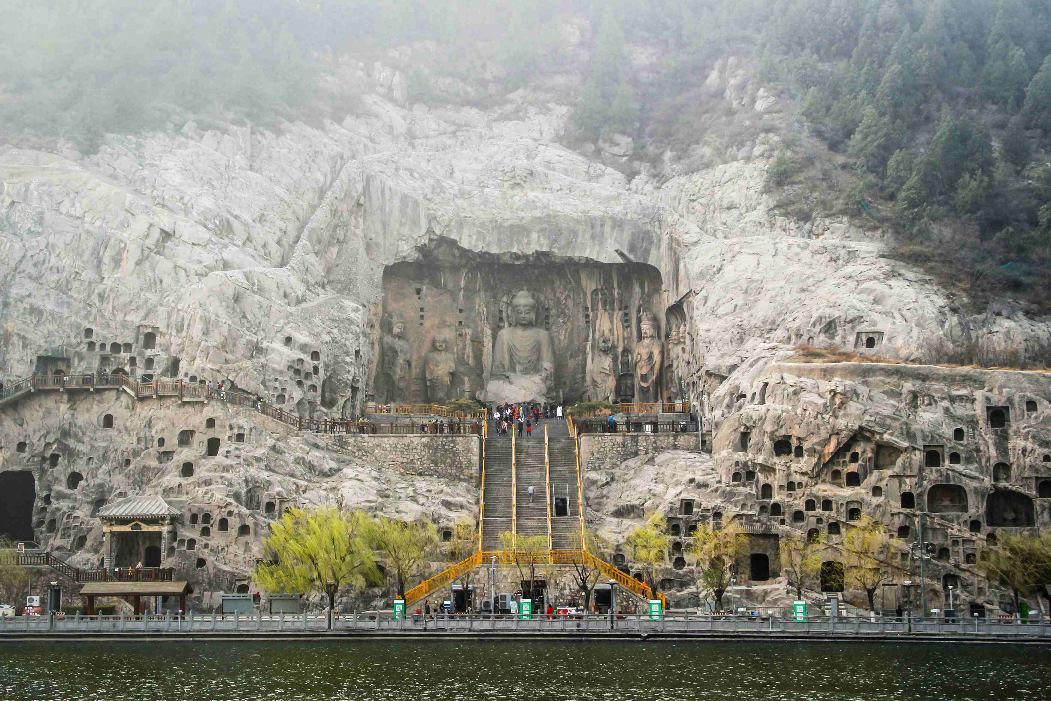 The Longmen Grottoes comprise of more than 2,300 caves and niches carved into the steep limestone cliffs 