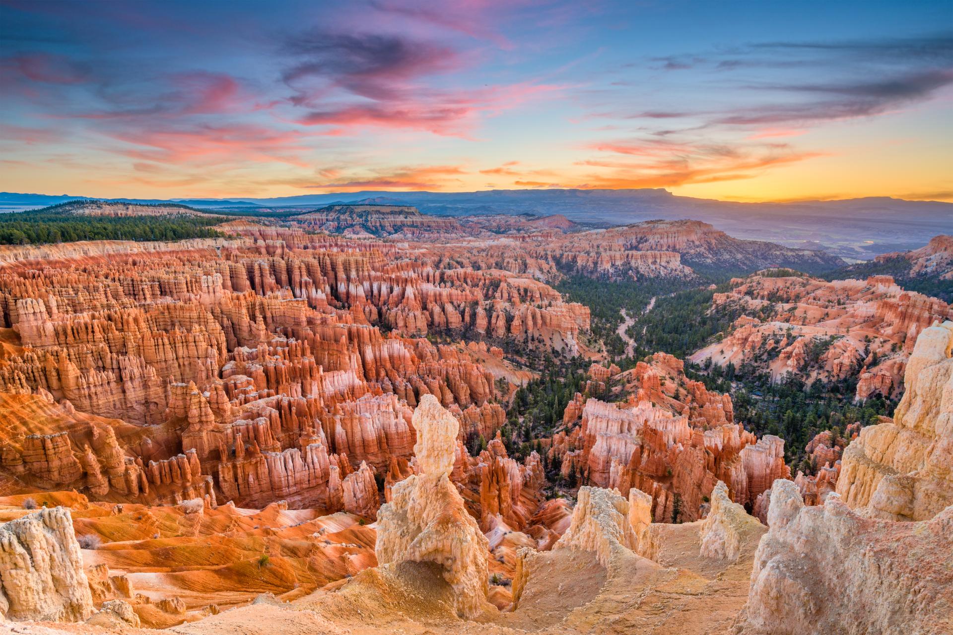 Stone and geographic formations of canyon at sunrise