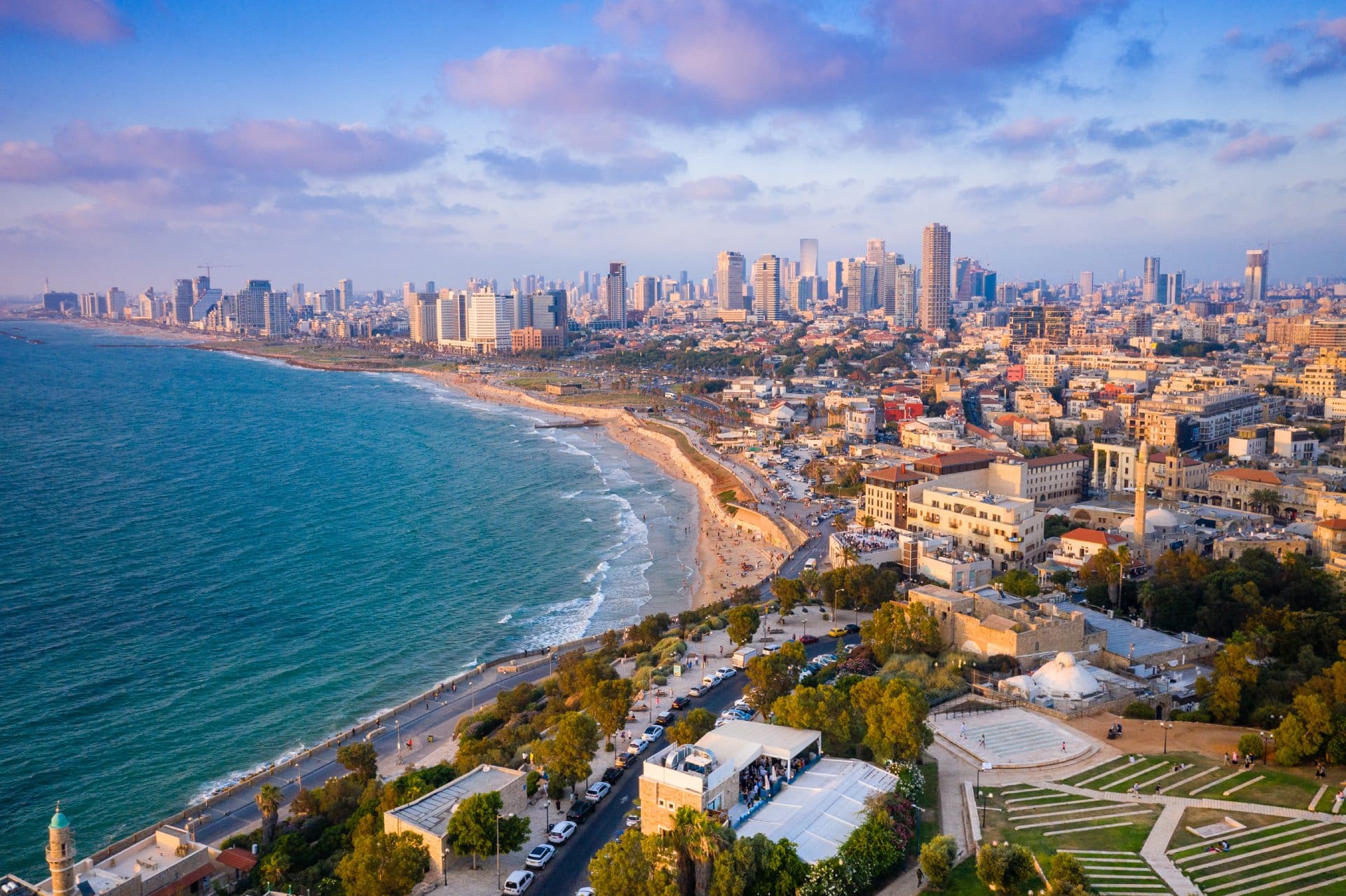 High Angle View Of Buildings By Sea Against Sky