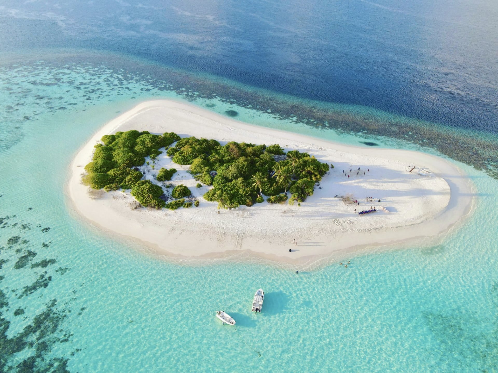 Aerial view of a white sand island in the morning