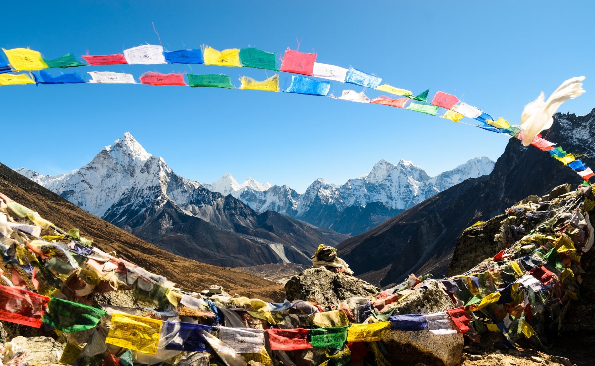 Ama Dablam framed with praying flags in Himalaya