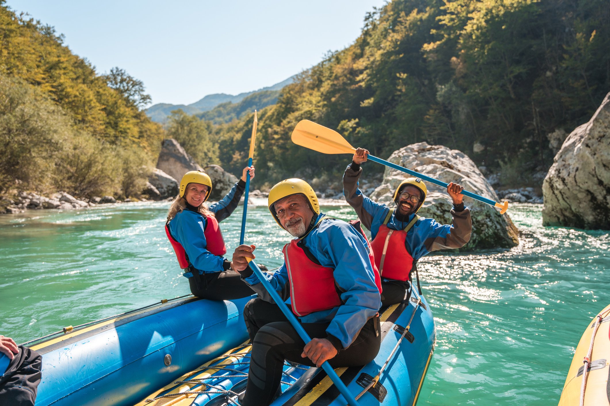 Slovenia A group of people kayaking on a river in Slovenia