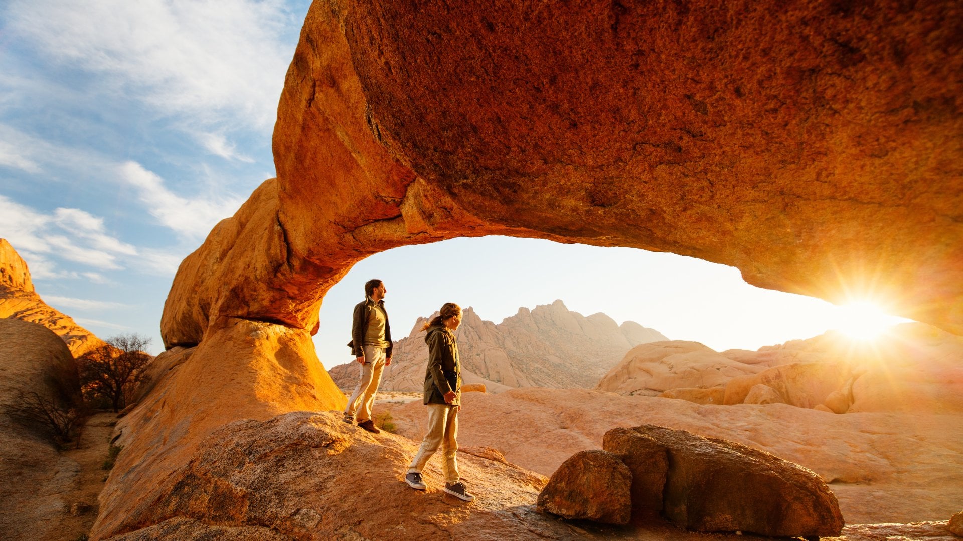 Spitzkoppe, Namibia sunrise red rock people hiking