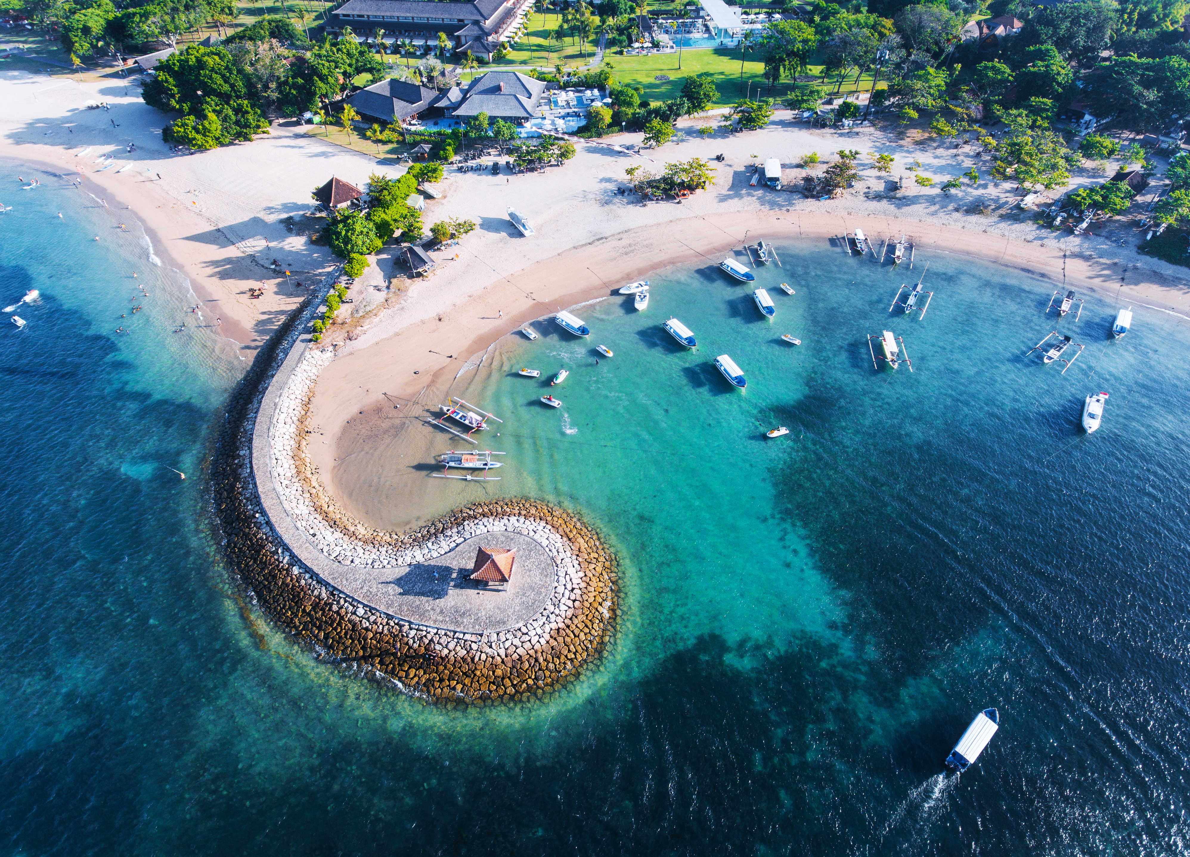 Bali Nusa Dua coast with a figurative breakwater aerial view.