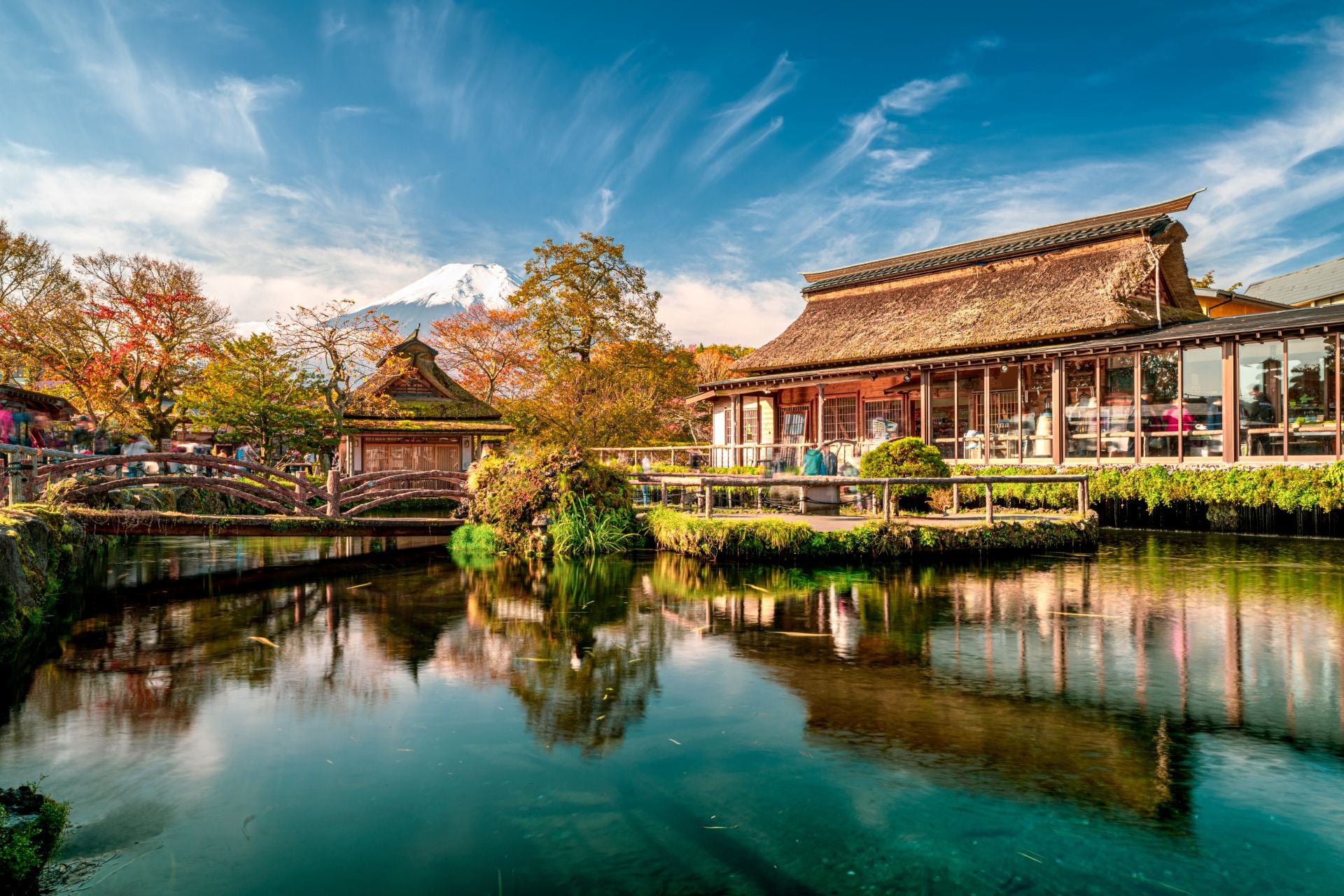 Beautiful Fuji mountain and pond reflection with Traditional Japanese style house at Oshino Hakkai in Japan.