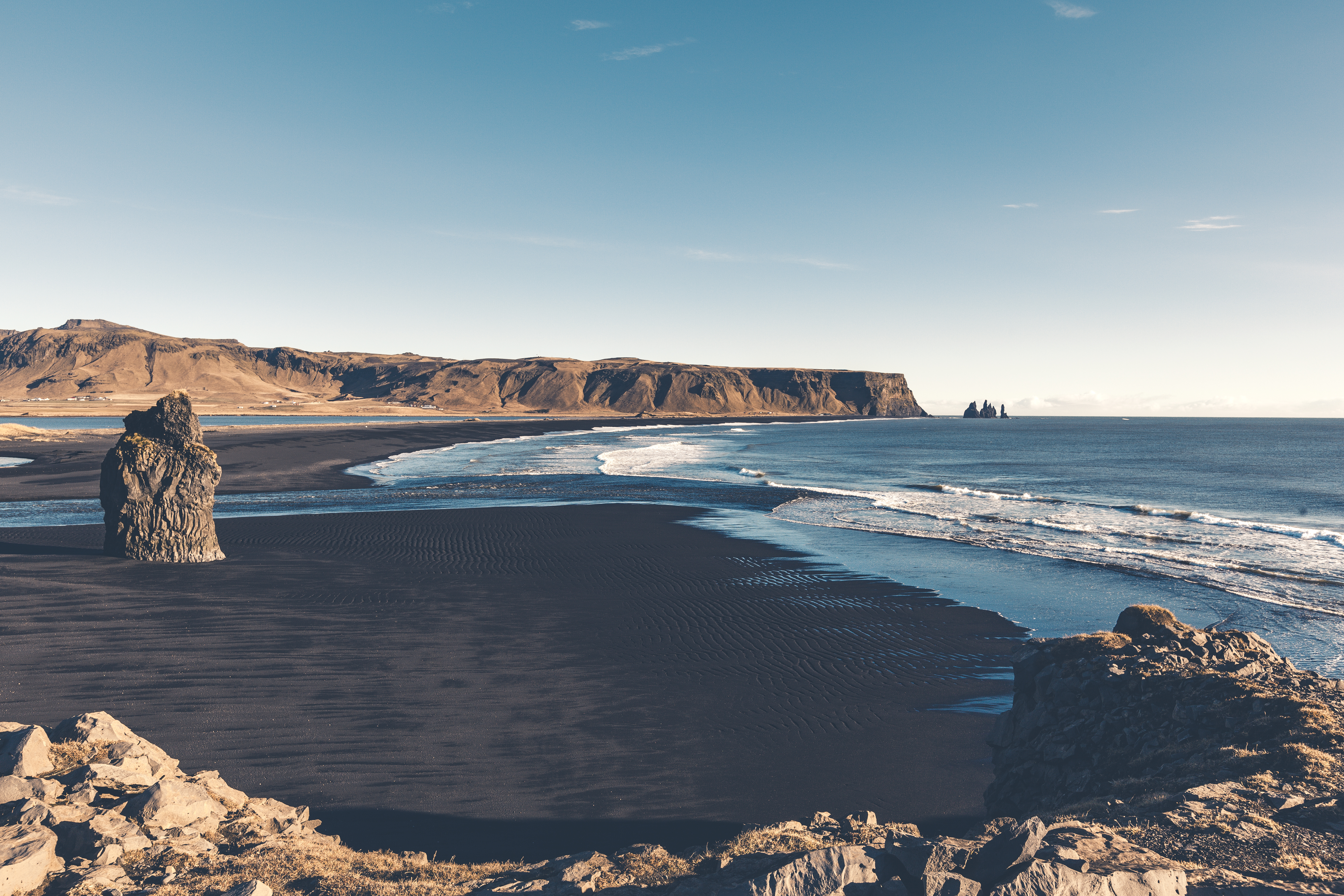 Cape Dyrholaey, Arnardrangur Rock on black sand beach.