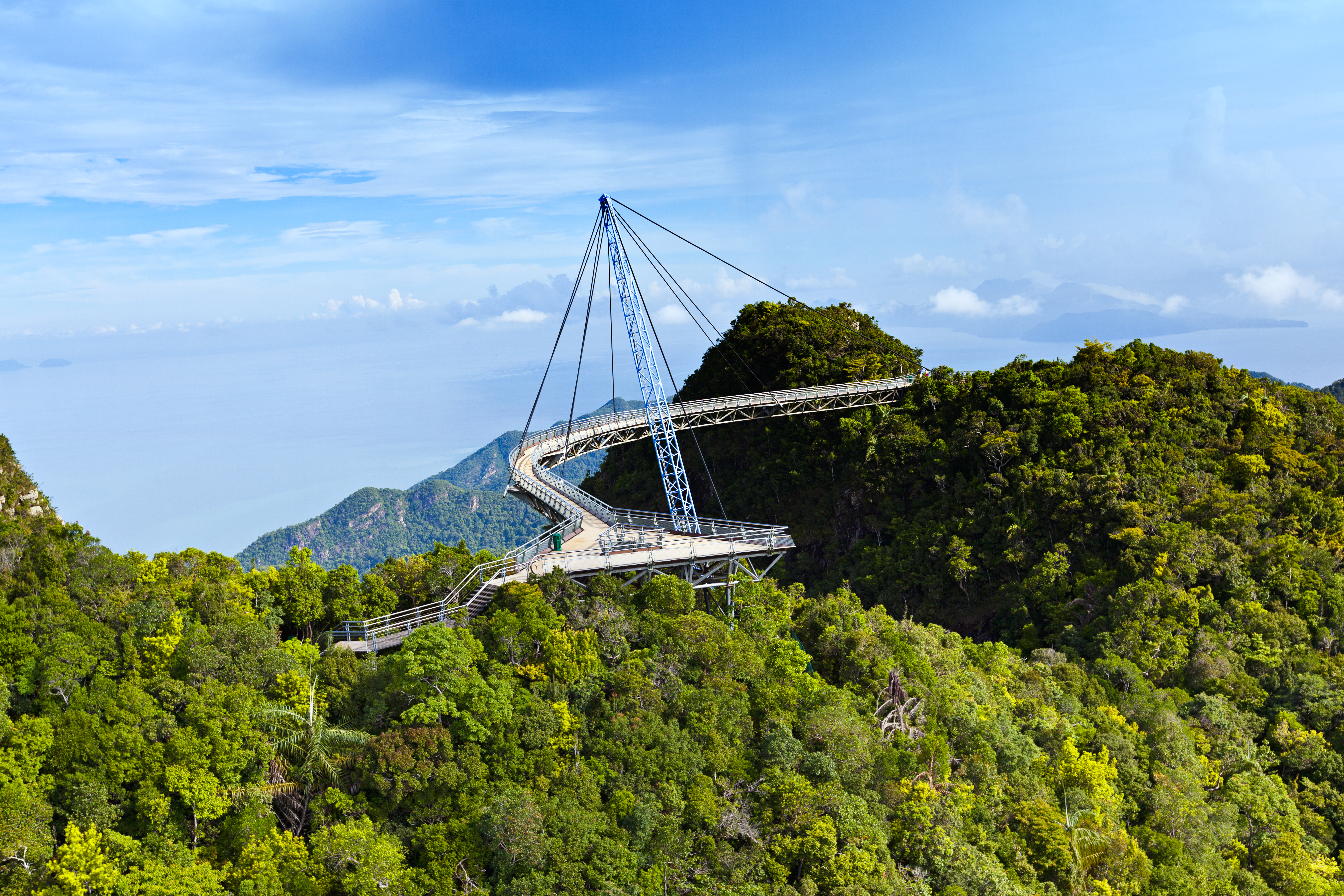Amazing cable bridge over the tropical rainforest island landscape.