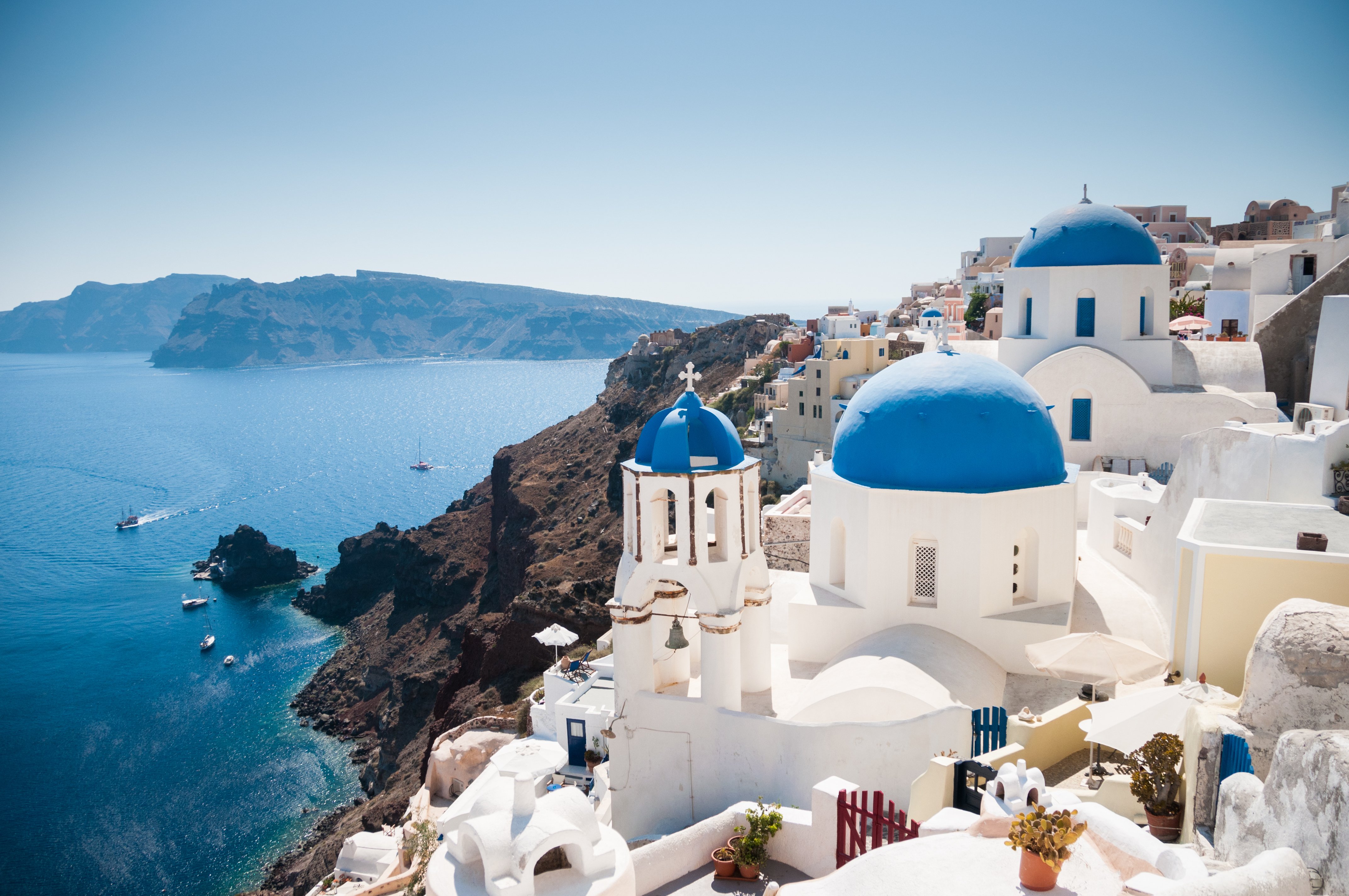 Blue domed church along caldera edge in Oia.