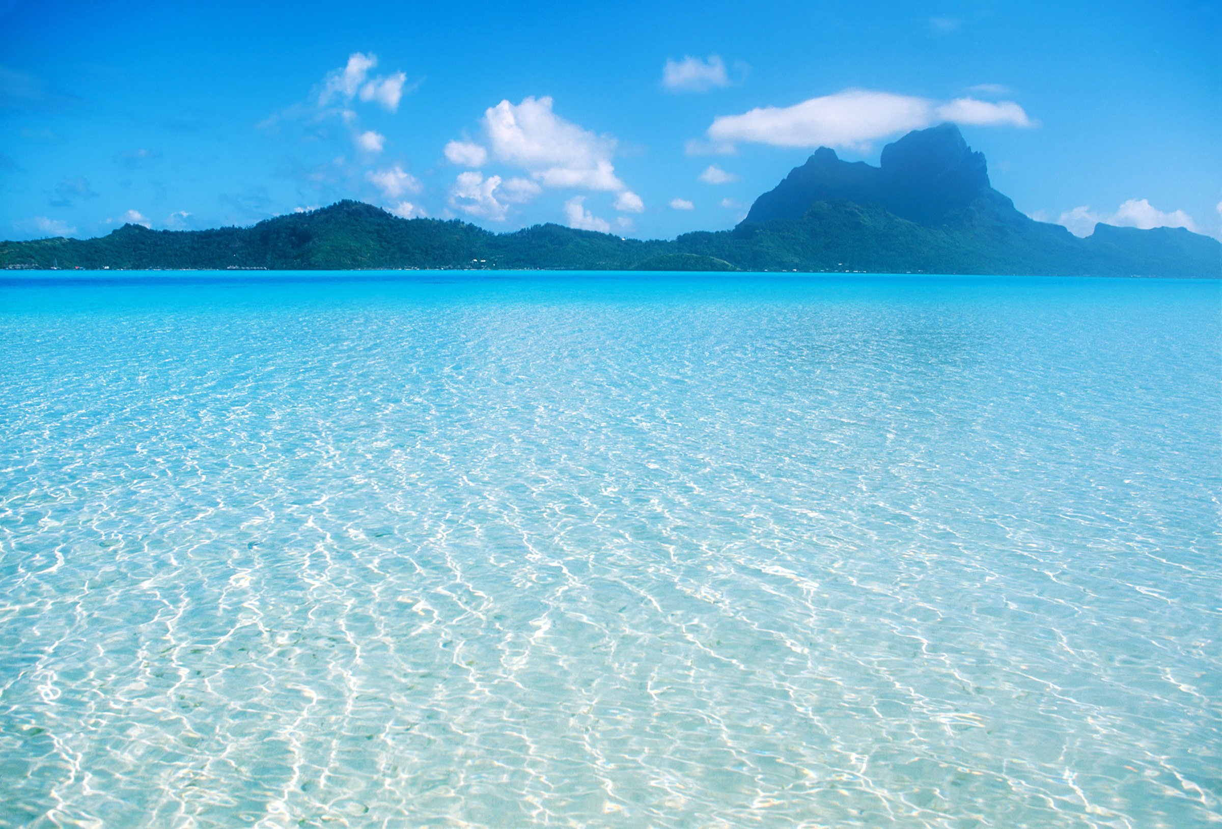 Clear and shallow blue waters in Bora Bora.