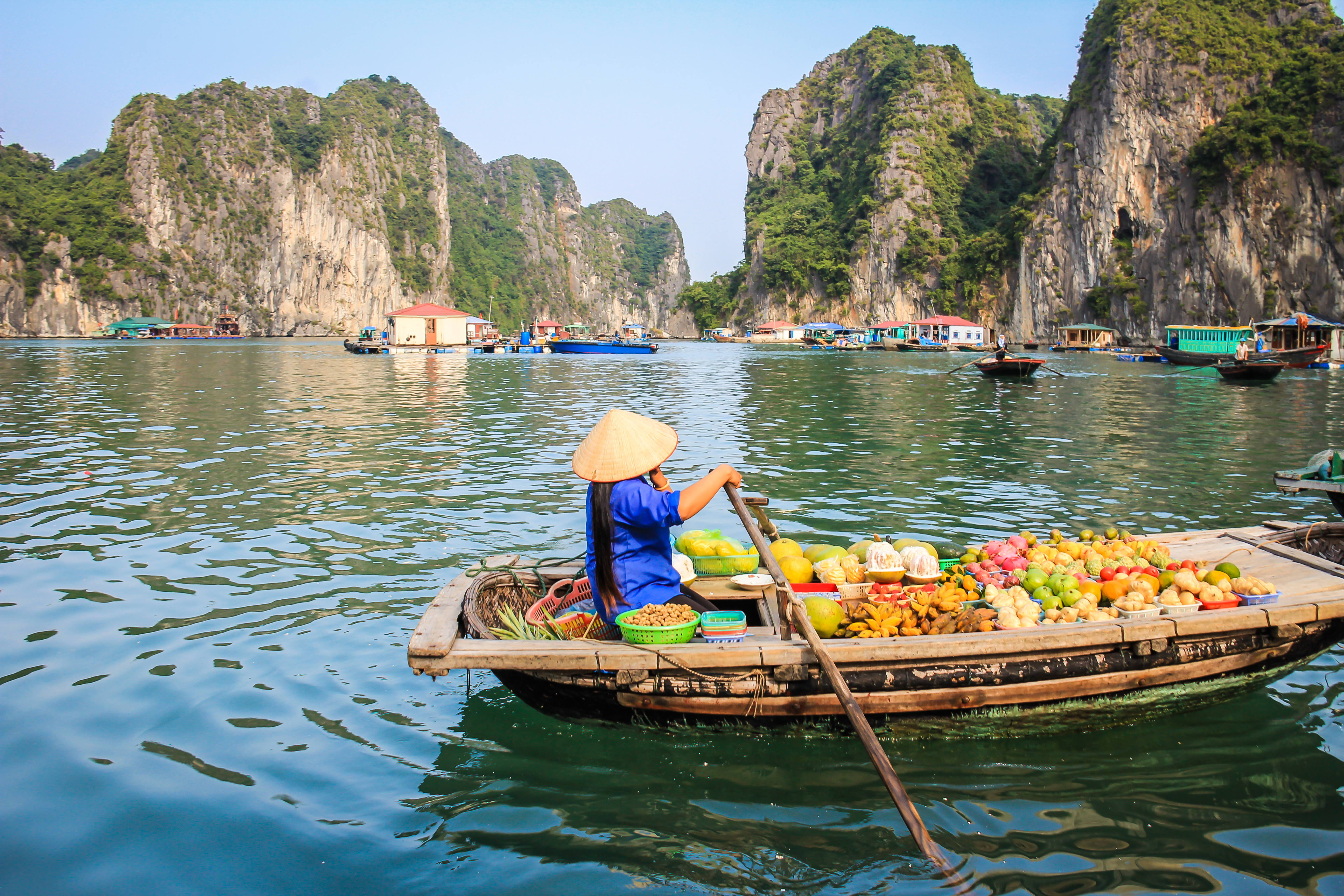 Fruit seller in a boat, Halong Bay Vietnam
