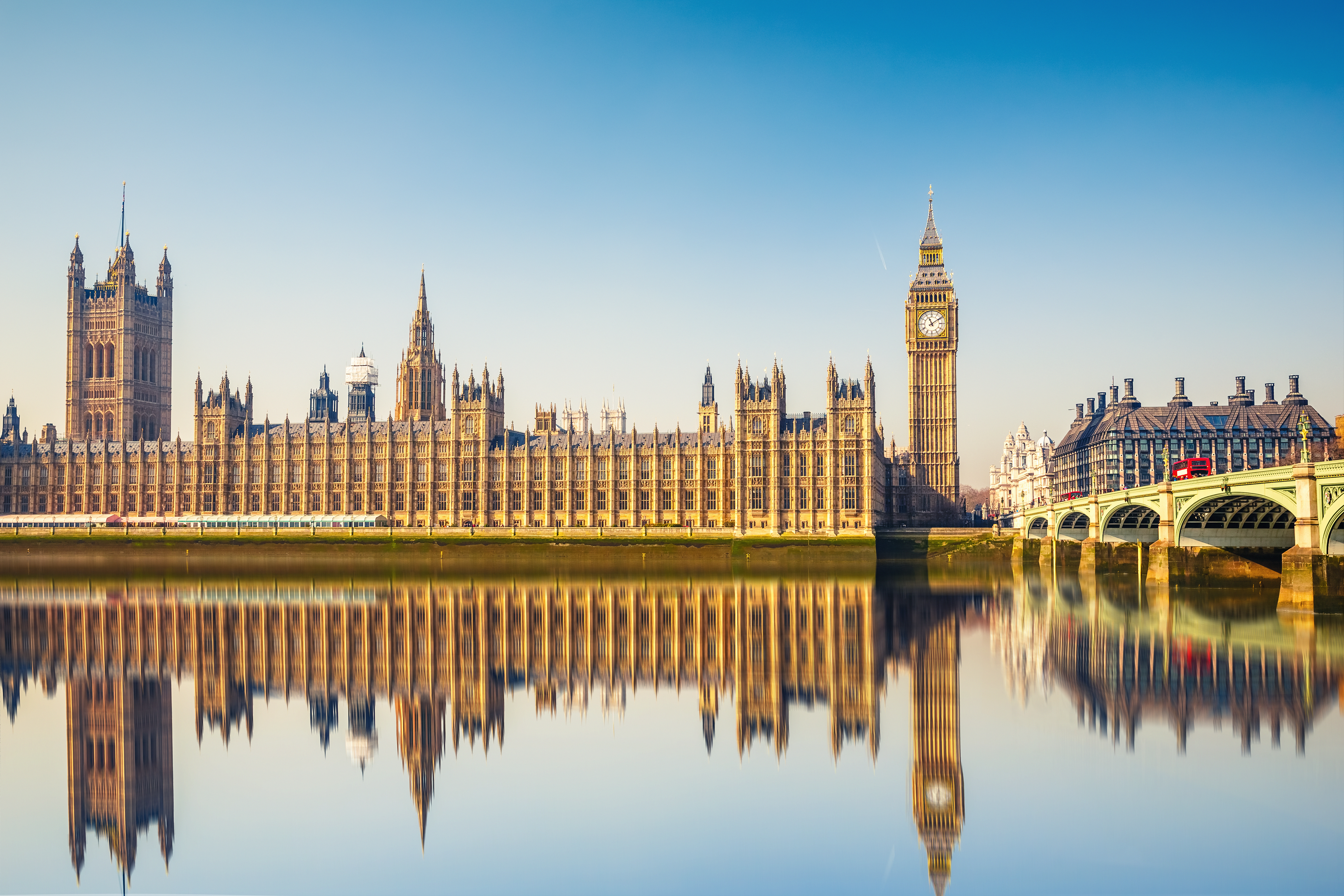 Big Ben and Houses of parliament at calm sunny morning.