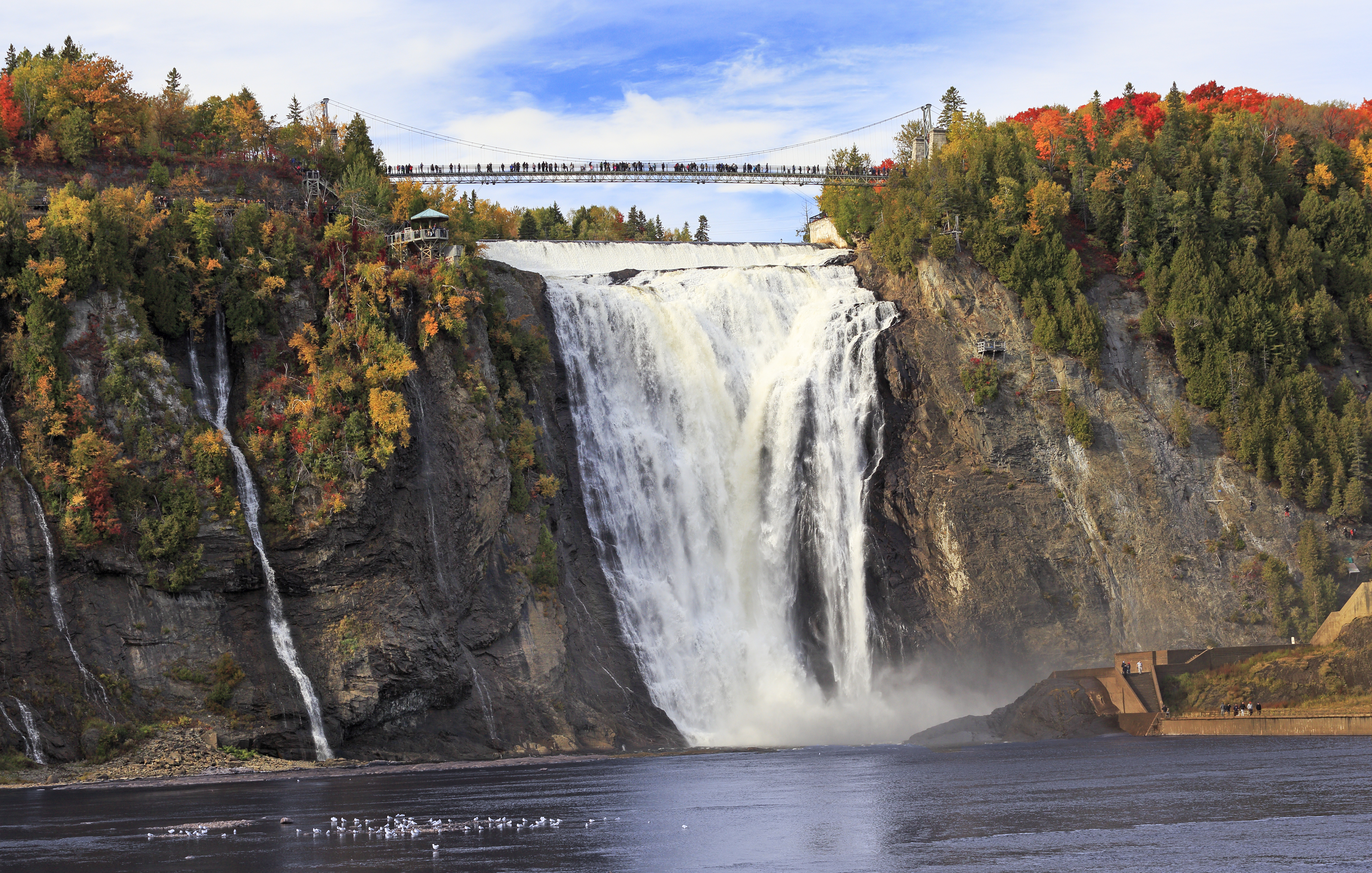 Montmorency Falls and Bridge in autumn with colorful trees