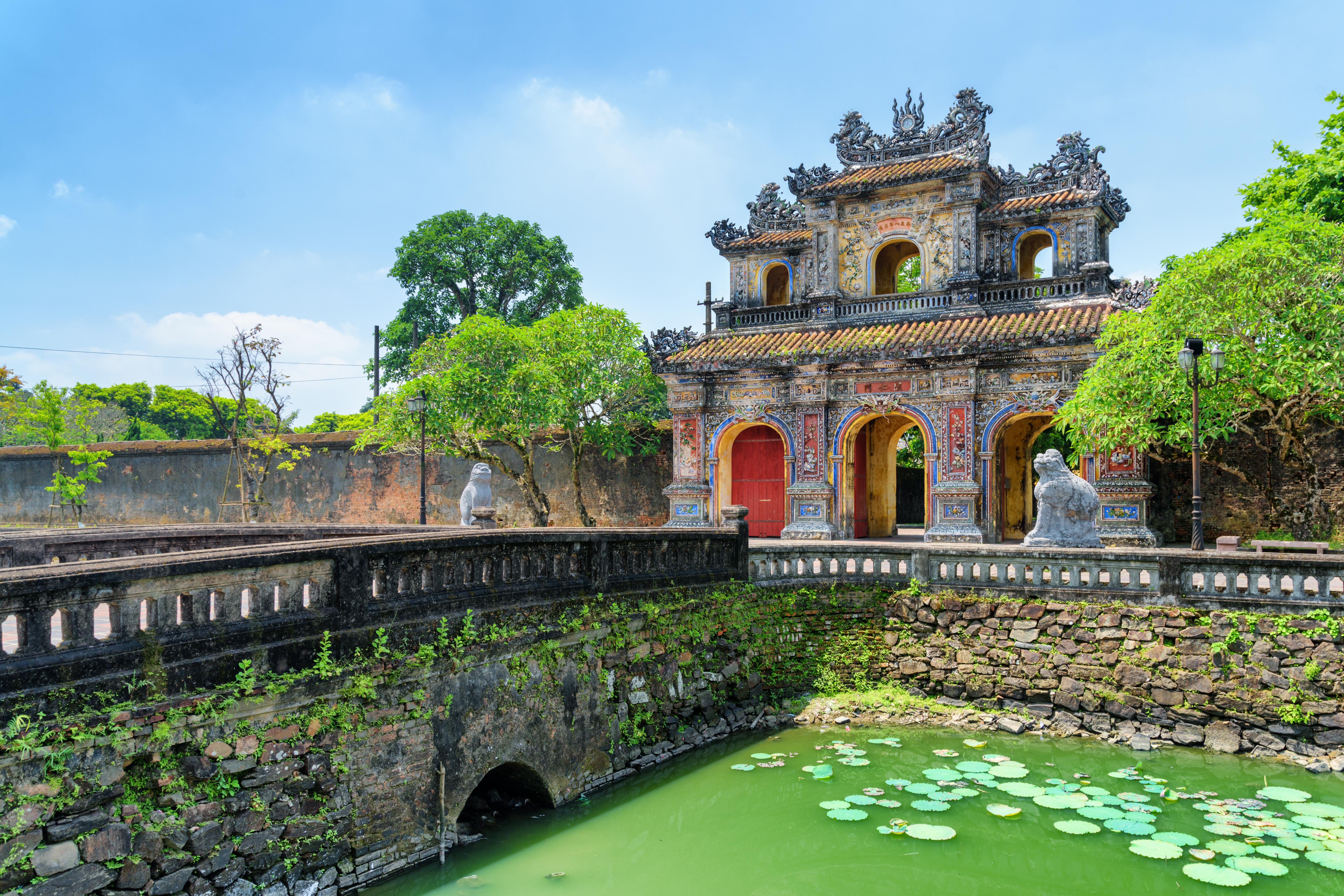 Wonderful view of the East Gate (Hien Nhon Gate) to the Citadel and a moat surrounding the Imperial City with the Purple Forbidden City. 
