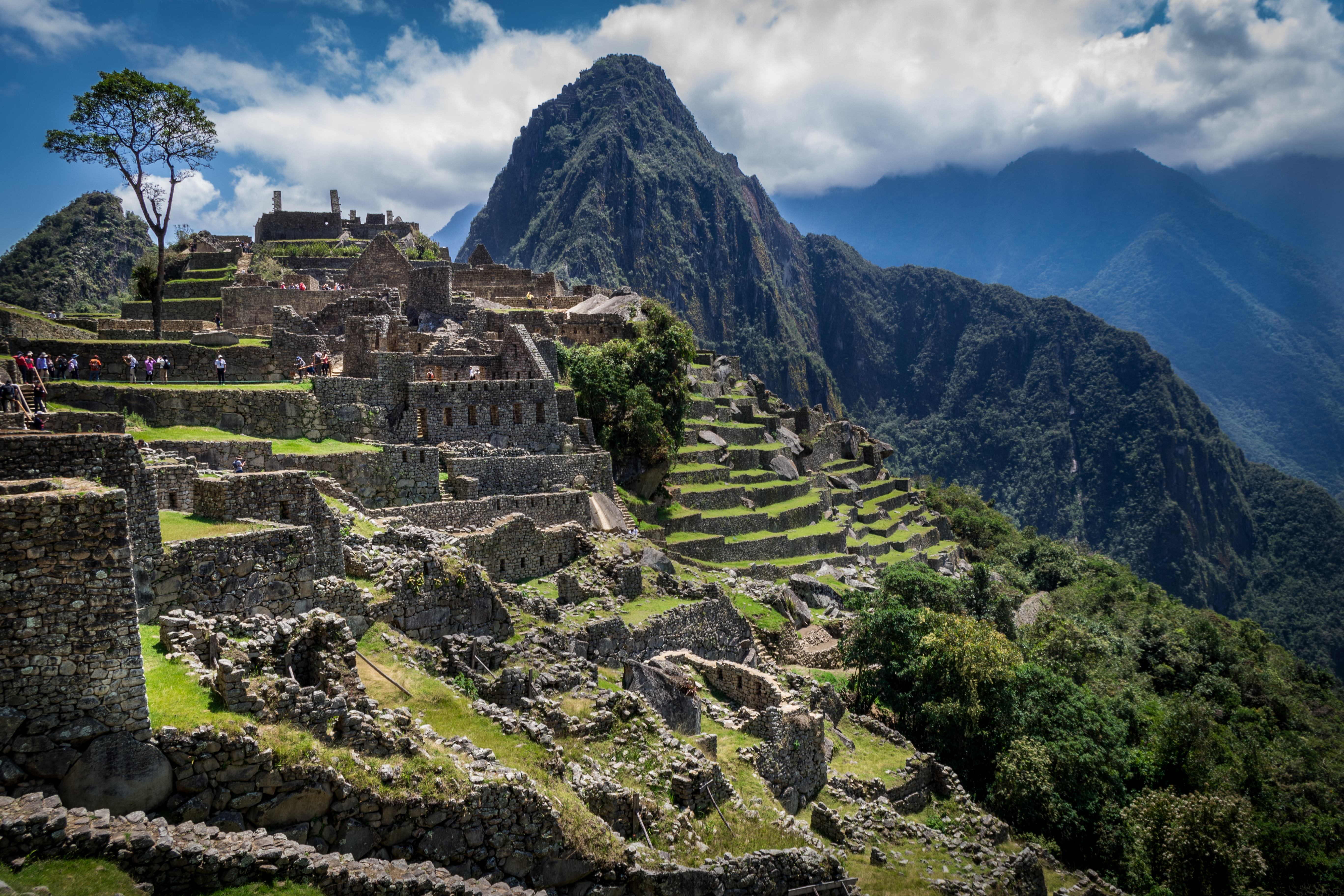 View of ancient ruins on Machu Picchu against a backdrop of mountains Sacred Valley of Peru