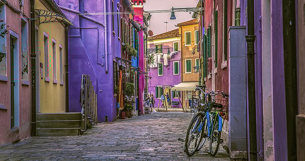 Escape the busy streets of Venice to tour the Pastel Buildings of Burano Island in the Venetian Lagoon
