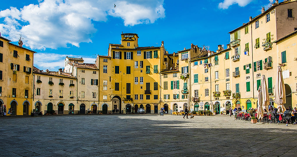 Explore the open plaza of Piazza Anfiteatro in the walled city of Lucca