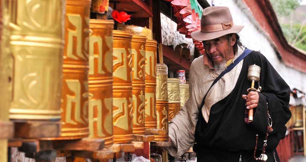 Tibetan pilgrim circles the Potala Palace Tibetan pilgrim circles the Potala Palace