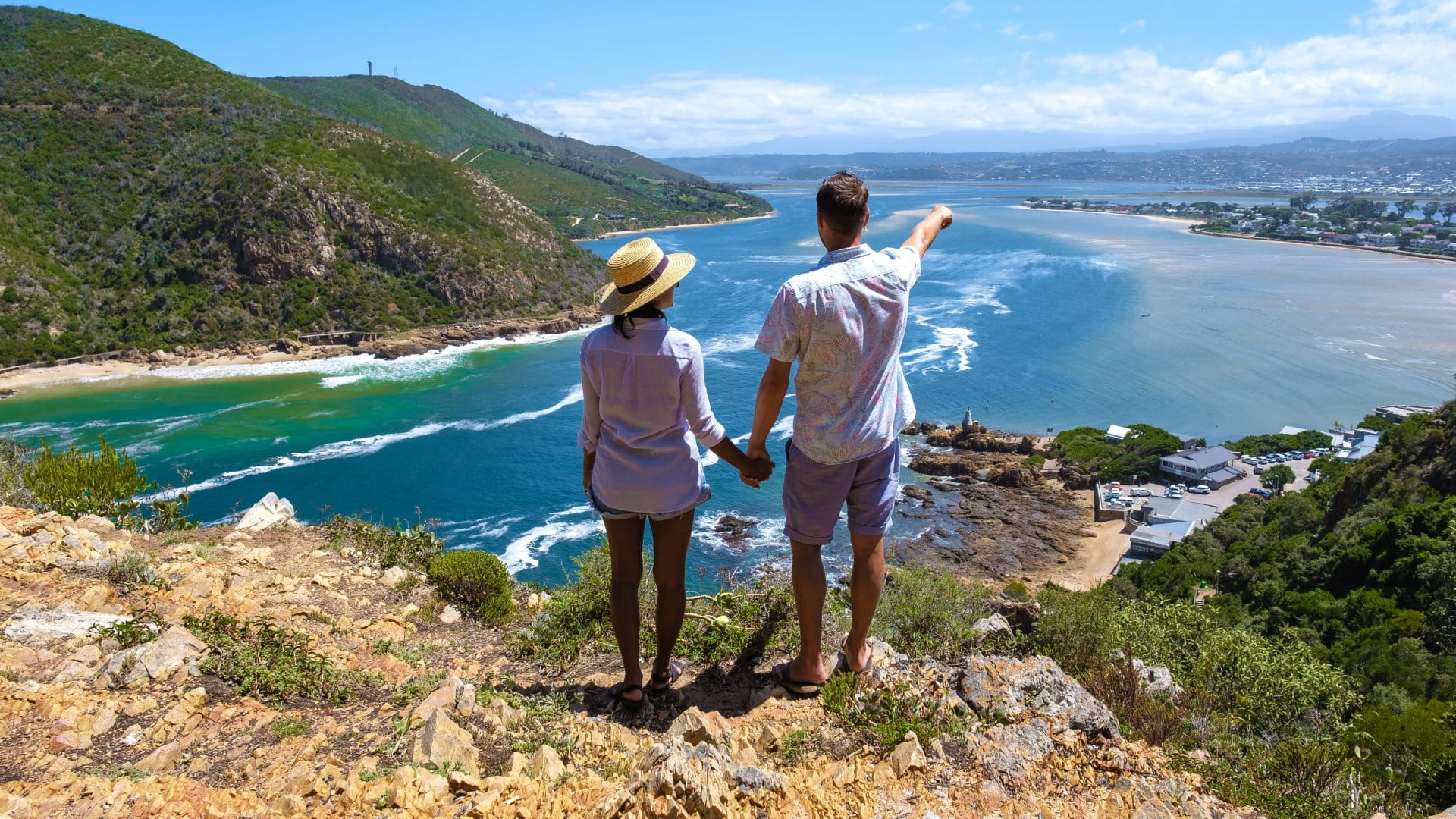 A panoramic view of the lagoon of Knysna, South Africa. beach in Knysna, Western Cape, South Africa. couple man and woman on a trip at the garden route