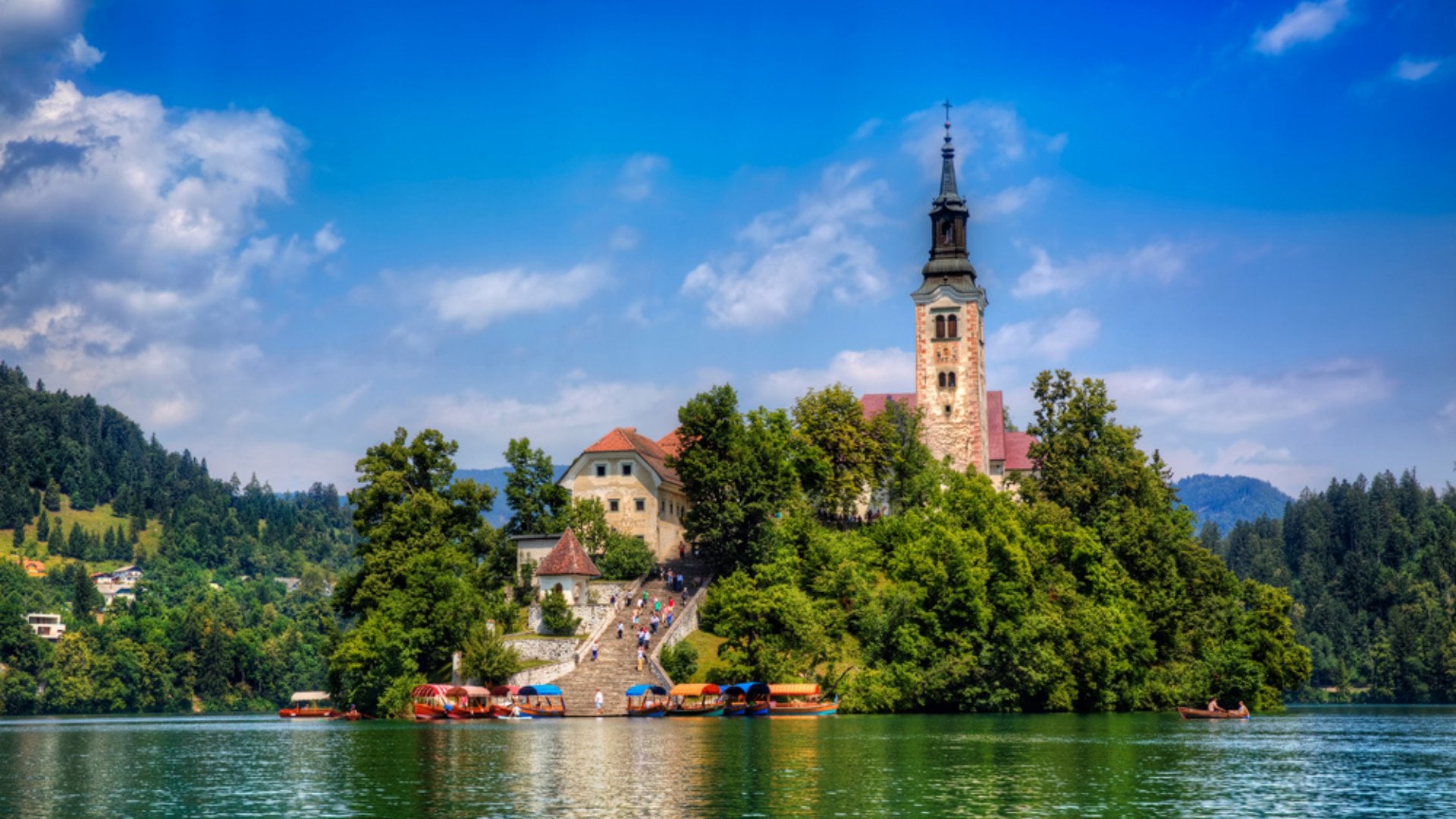 Boats moored by the steps at Bled Island in Lake Bled, Slovenia