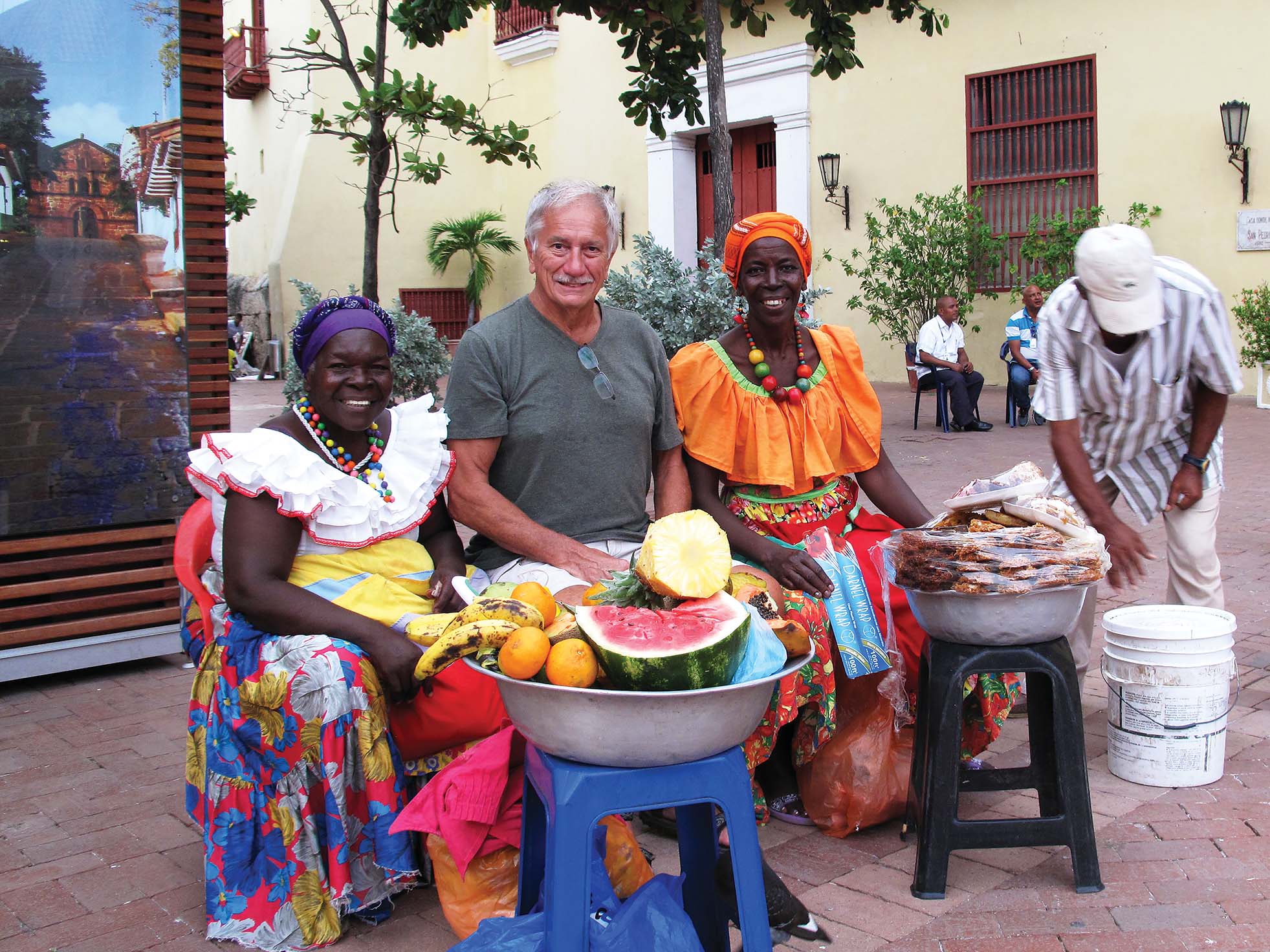 Bruce Hodge poses with new friends in the streets of Cartagena, Colombia