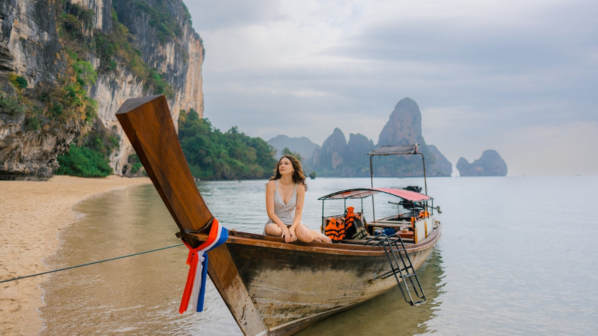 Cheerful woman on Thai taxi boat in Ao Nang, Krabi