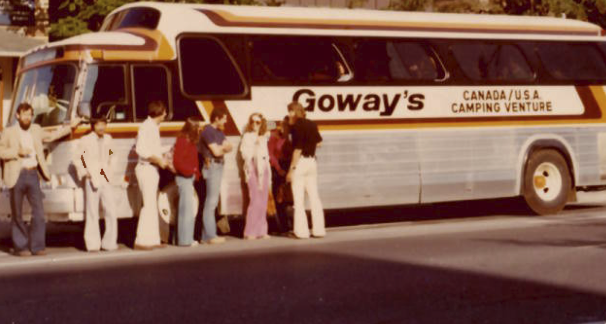 Young travellers beside a Goway’s Canada/USA Camping Venture coach bus in the 1970s
