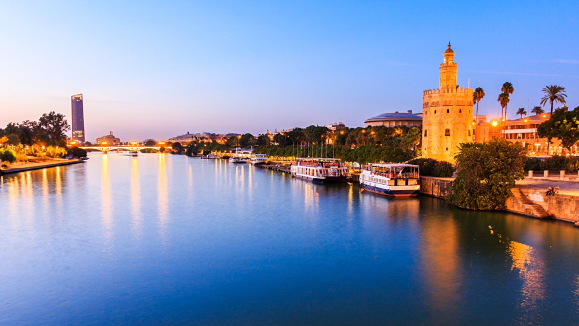 Guadalquivir River and Golden Tower (Torre del Oro), Seville, Andalusia, Spain