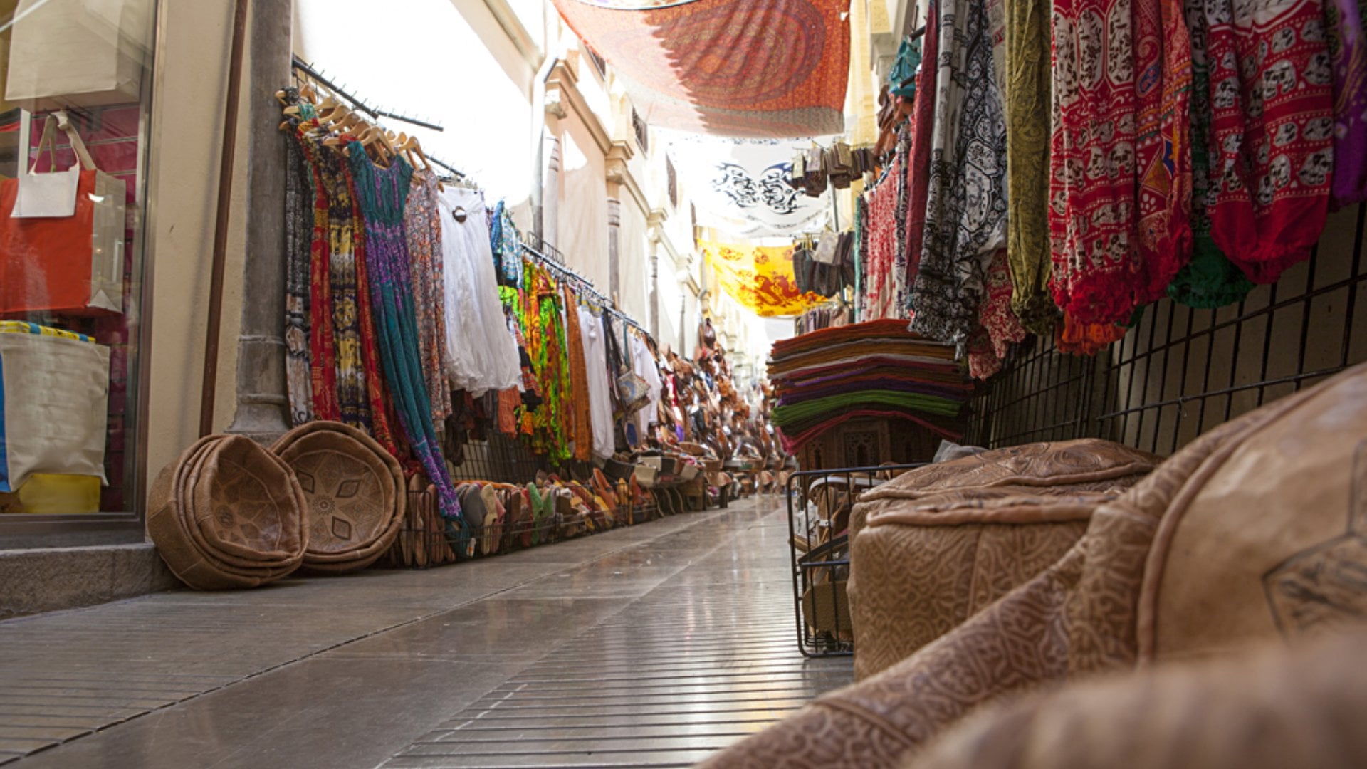 Narrow streets filled with shops in Alcaiceria District, originally home to a Moorish silk market, Granada, Andalusia, Spain