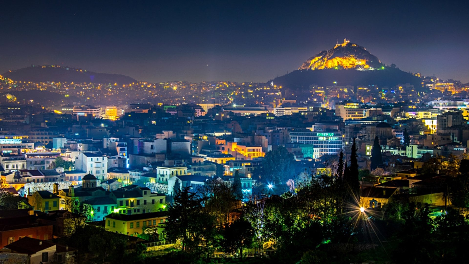 Night Aerial View of Mount Lycabettus and its neighborhood in Athens, Greece