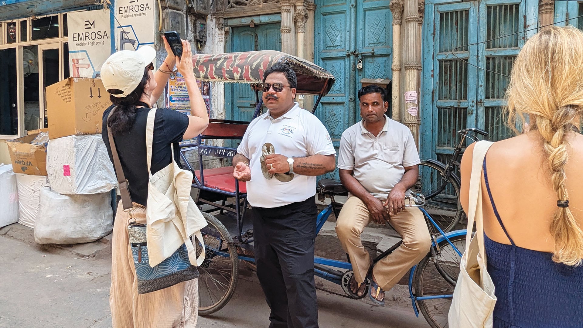 Dr. Rajeev Goyal standing in the streets of Old Delhi on a food tour