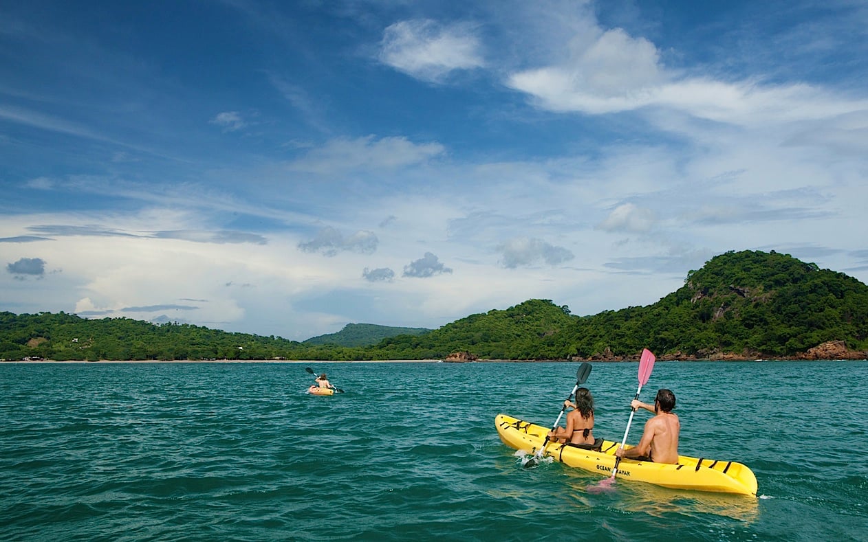 Kayakers paddling to Las Isletas in Granada, Nicaragua.