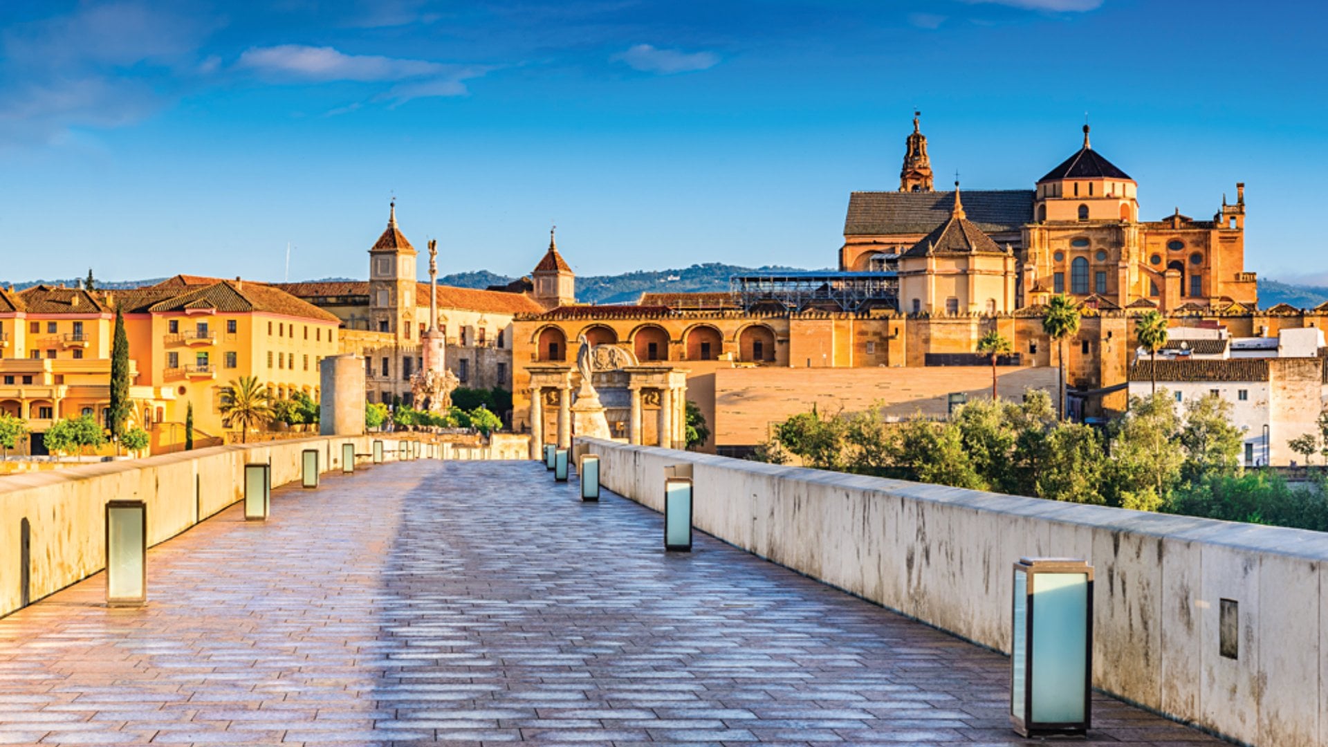 Roman Bridge on Guadalquivir River and The Great Mosque (Mezquita Cathedral), Cordoba, Andalusia, Spain