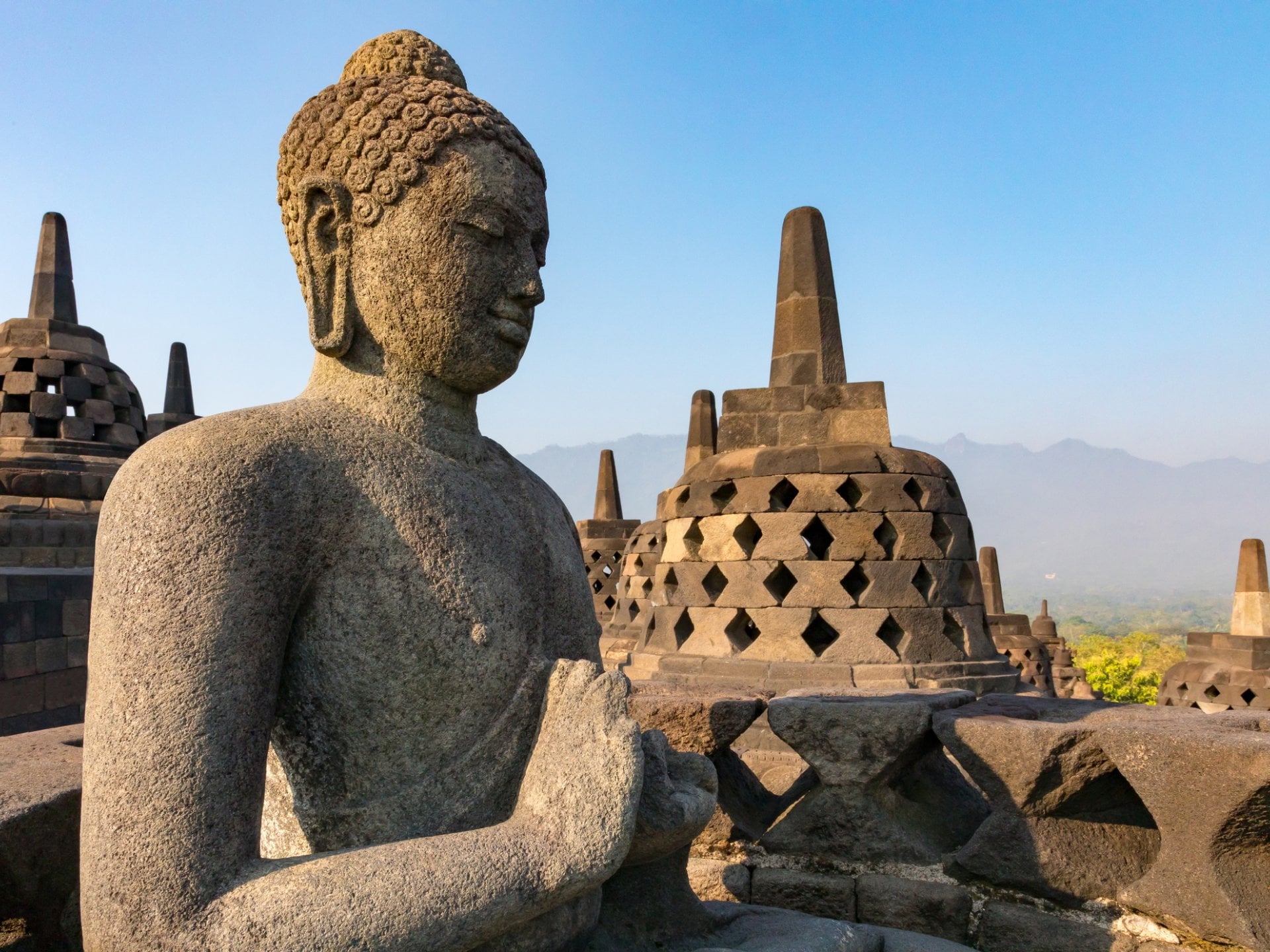 Stone Buddha statue at the 9th century temple of Borobudur