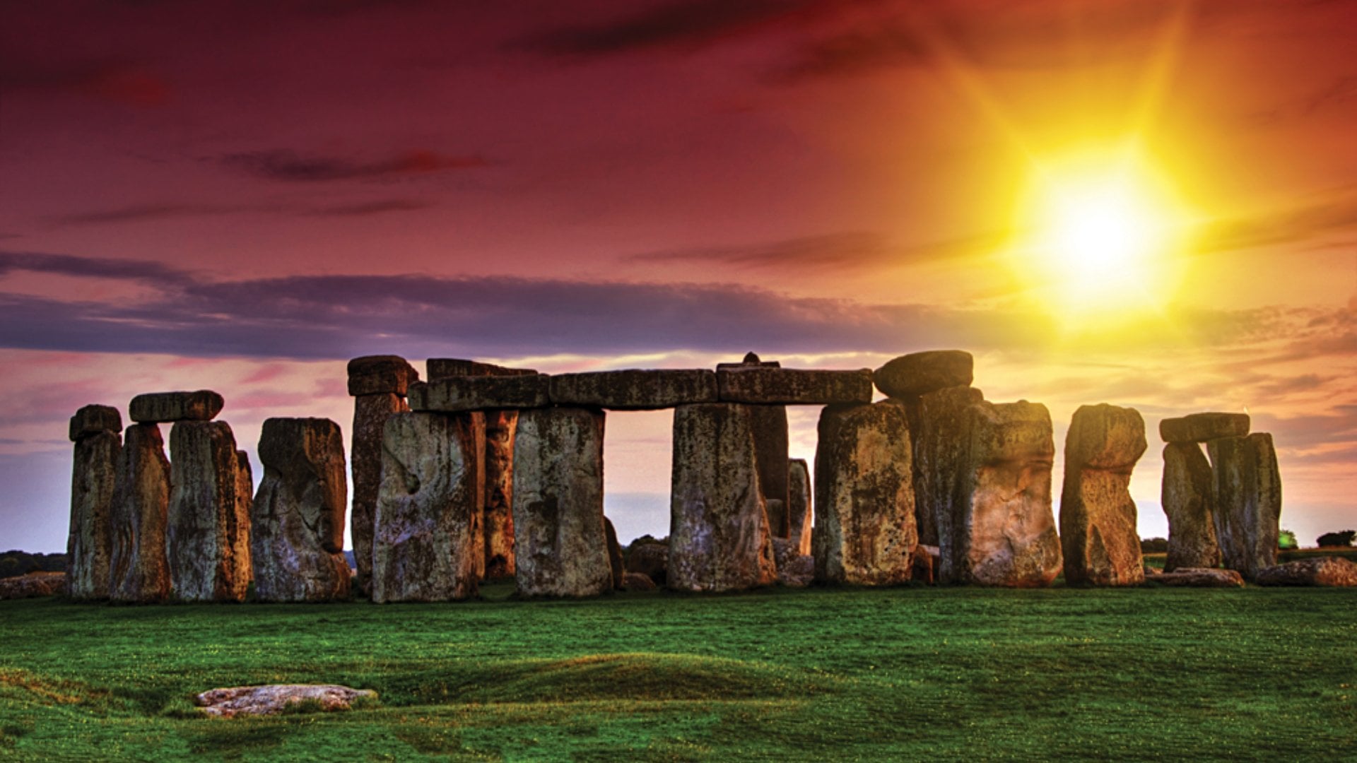 Sunset at Stonehenge with Dramatic Sky and Sun Rays, England, UK