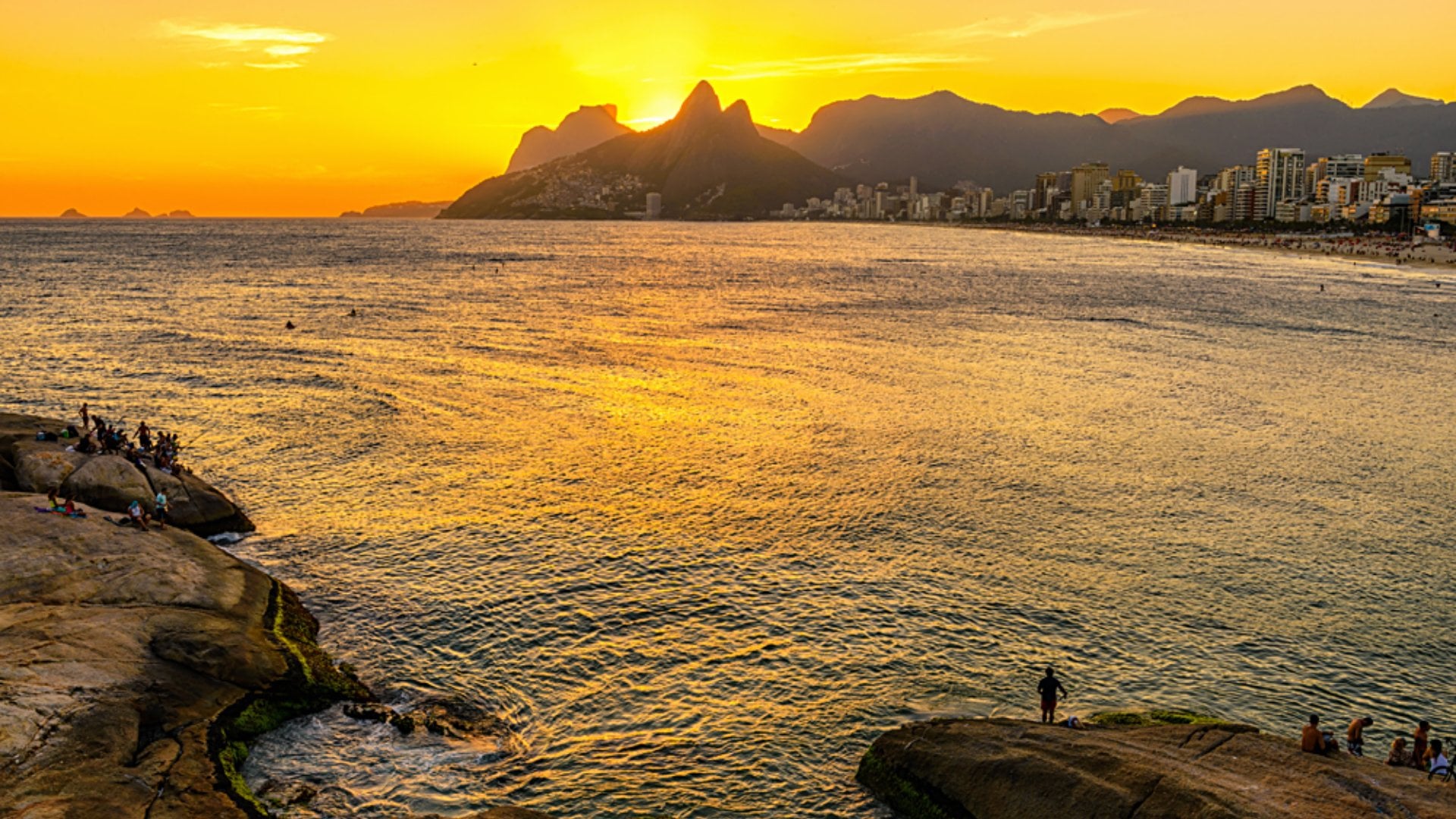 Sunset on Ipanema beach and mountain Dois Irmao (Two Brother) seen from Aproador, Rio de Janeiro, Brazil