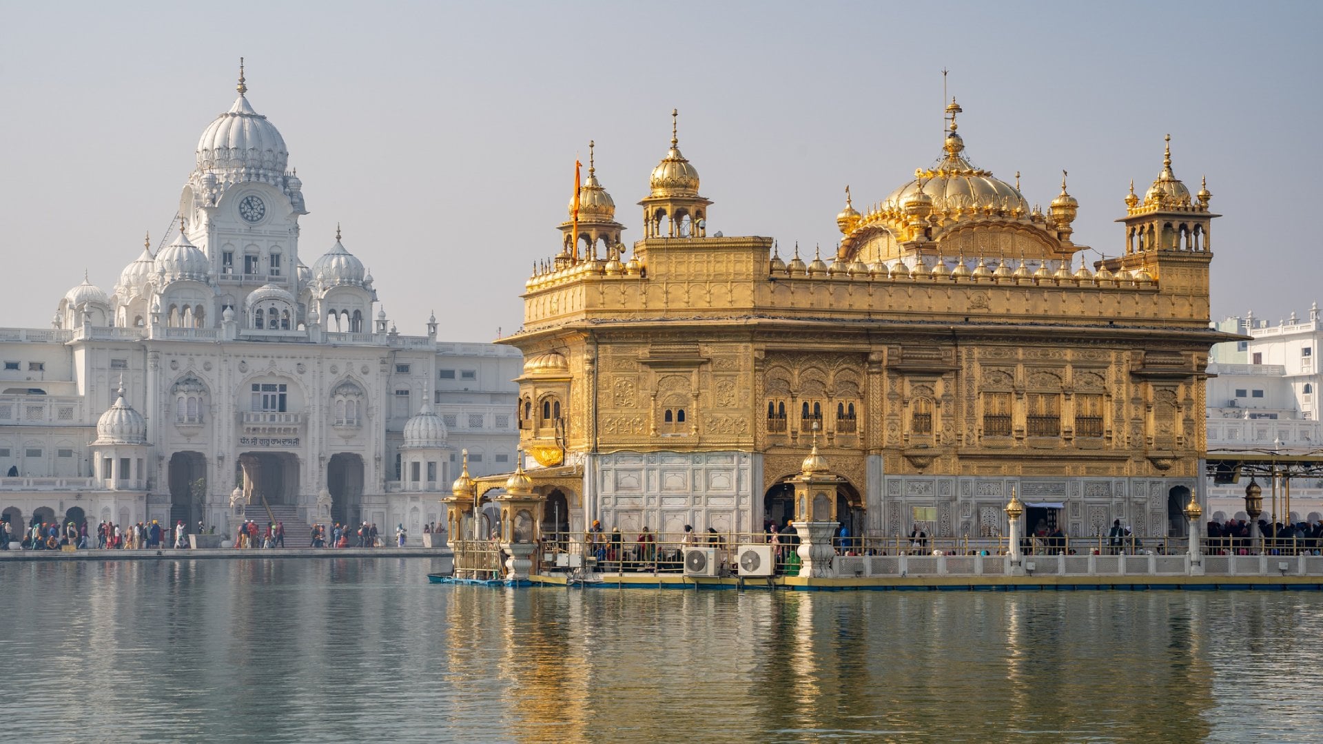 The famous Sikh Golden Temple (sri harmandir sahib), as crowds make their way inside the building