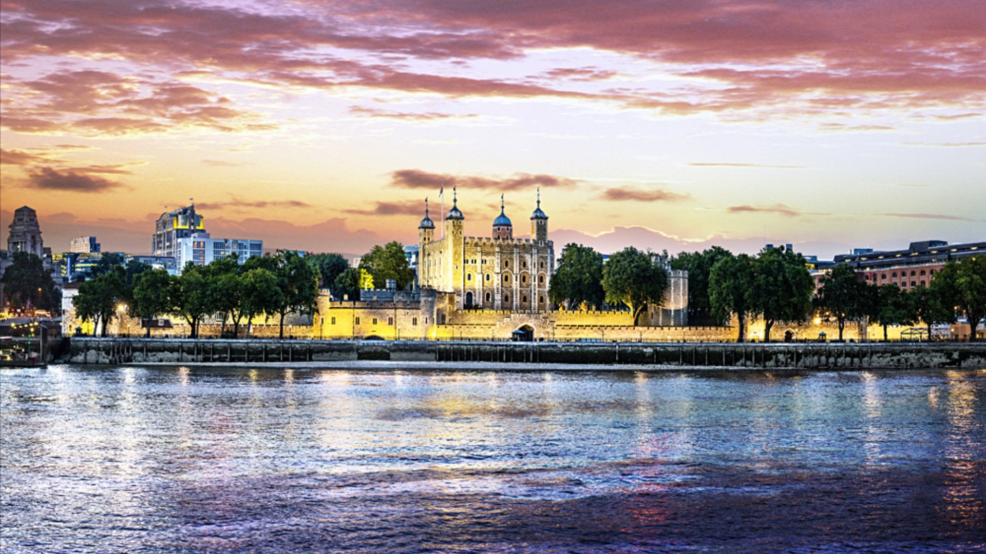 View of Tower of London at twilight from across the River Thames, London, England, UK | Photo Credit: VistBritain/Andrew Pickett
