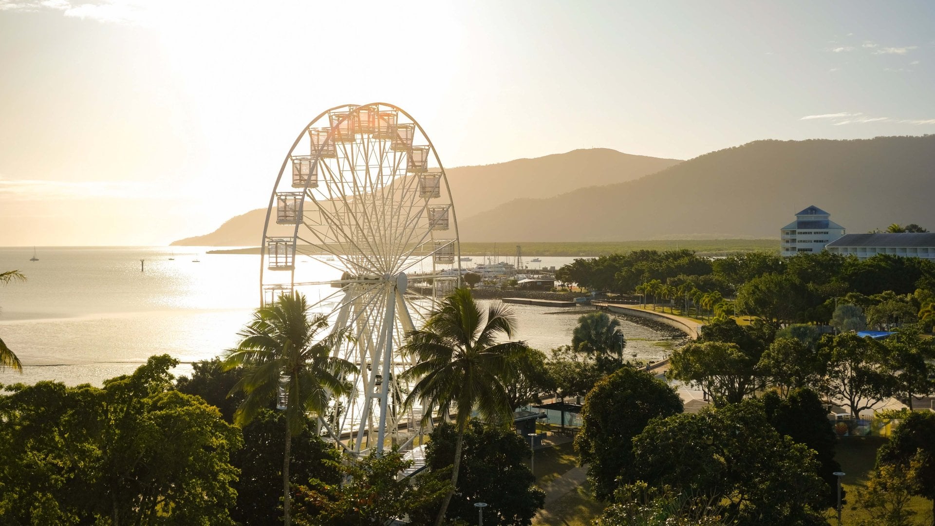 View of a ferris wheel at the Cairns Esplenade in Cairns, Queensland, Australia, at sunset,