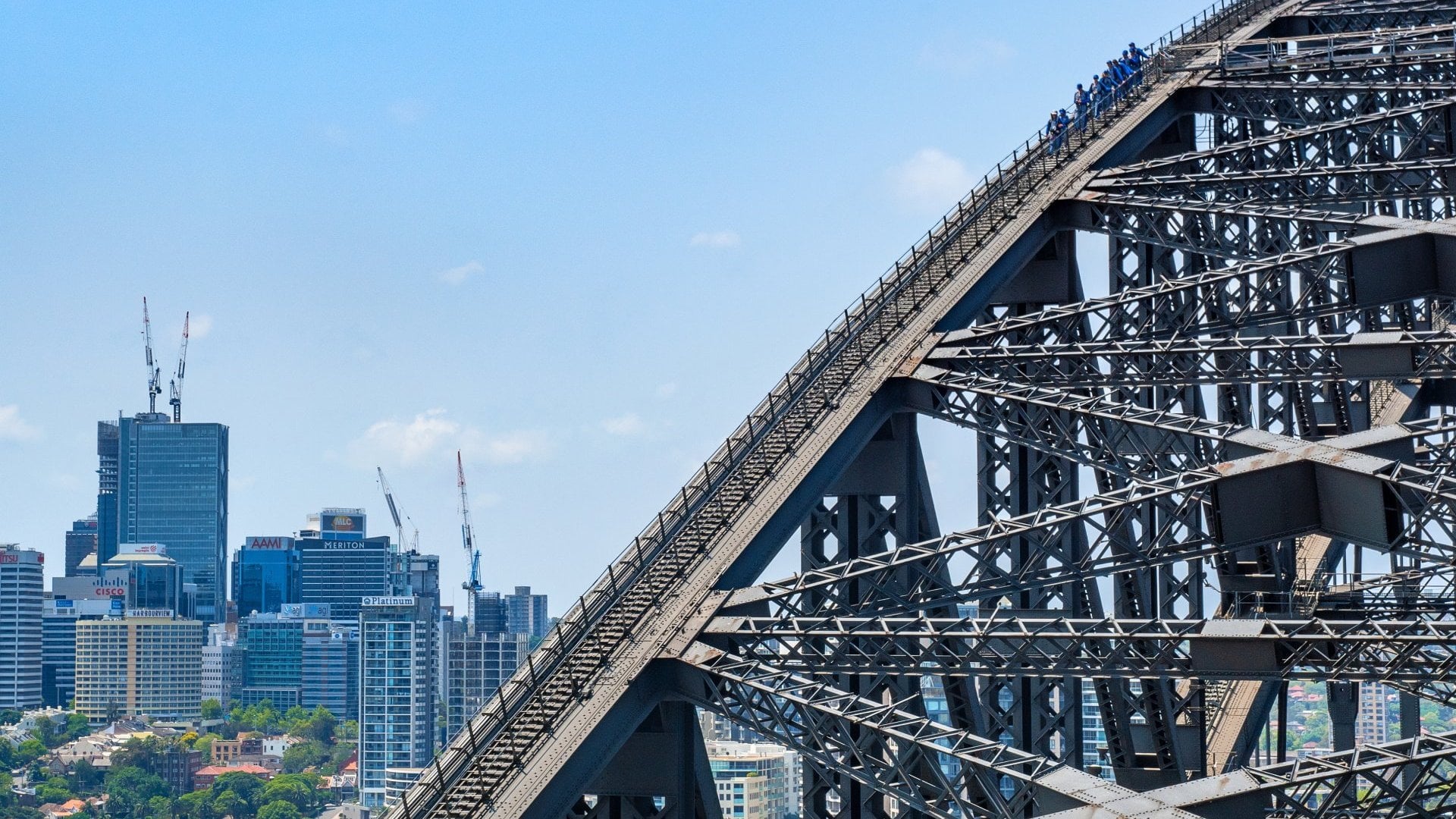 View of the top of the arch of Sydney Harbour Bridge. Tourists can walk on the top of bridge where the walk reaches a height of 134 metres.