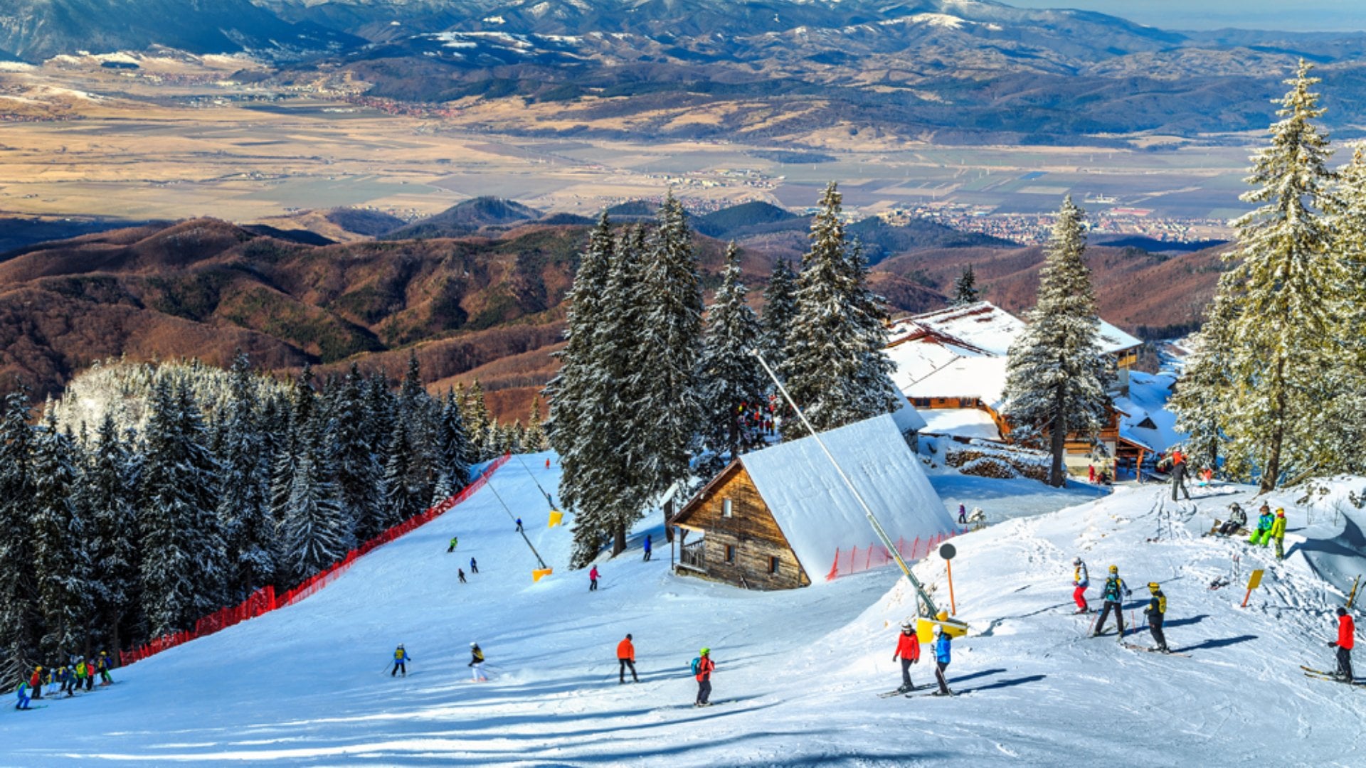 Wooden Chalets and Spectacular Ski Slopes in the Carpathians at Poiana Brasov Ski Resort, Transylvania, Romania
