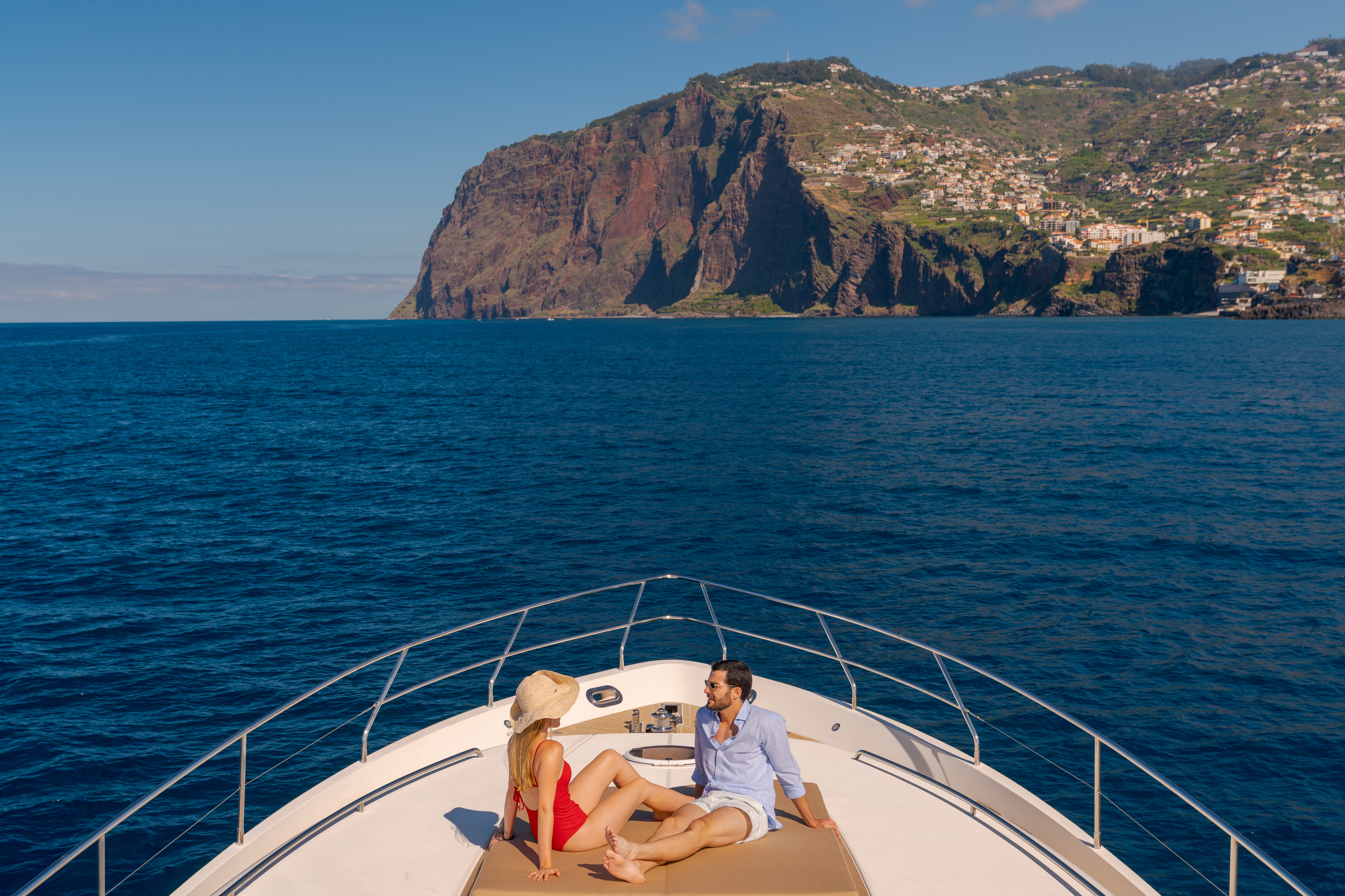 A man and woman on a yacht in Madeira, Portugal.