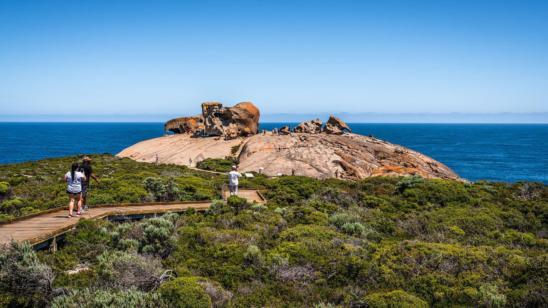 people walking down a boardwalk towards the Remarkable Rocks of Kangaroo Island's Flinders Chase National Park