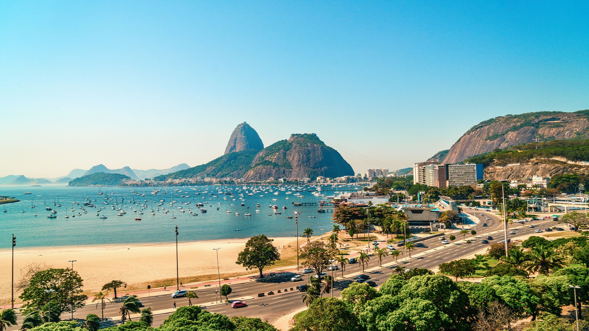 view of the pristine beach with backdrop of Sugarloaf Mountain in Rio de Janeiro
