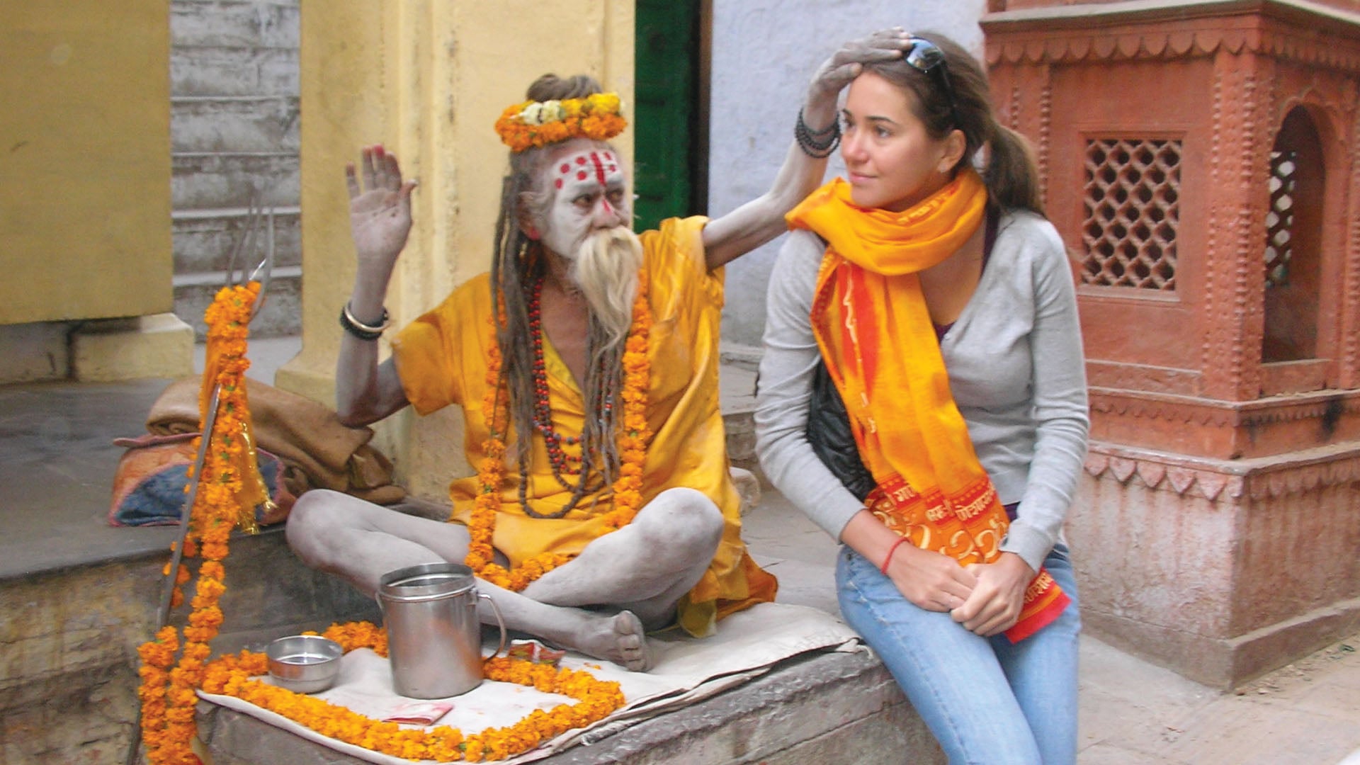A white tourist woman with a holy man in Varanasi India