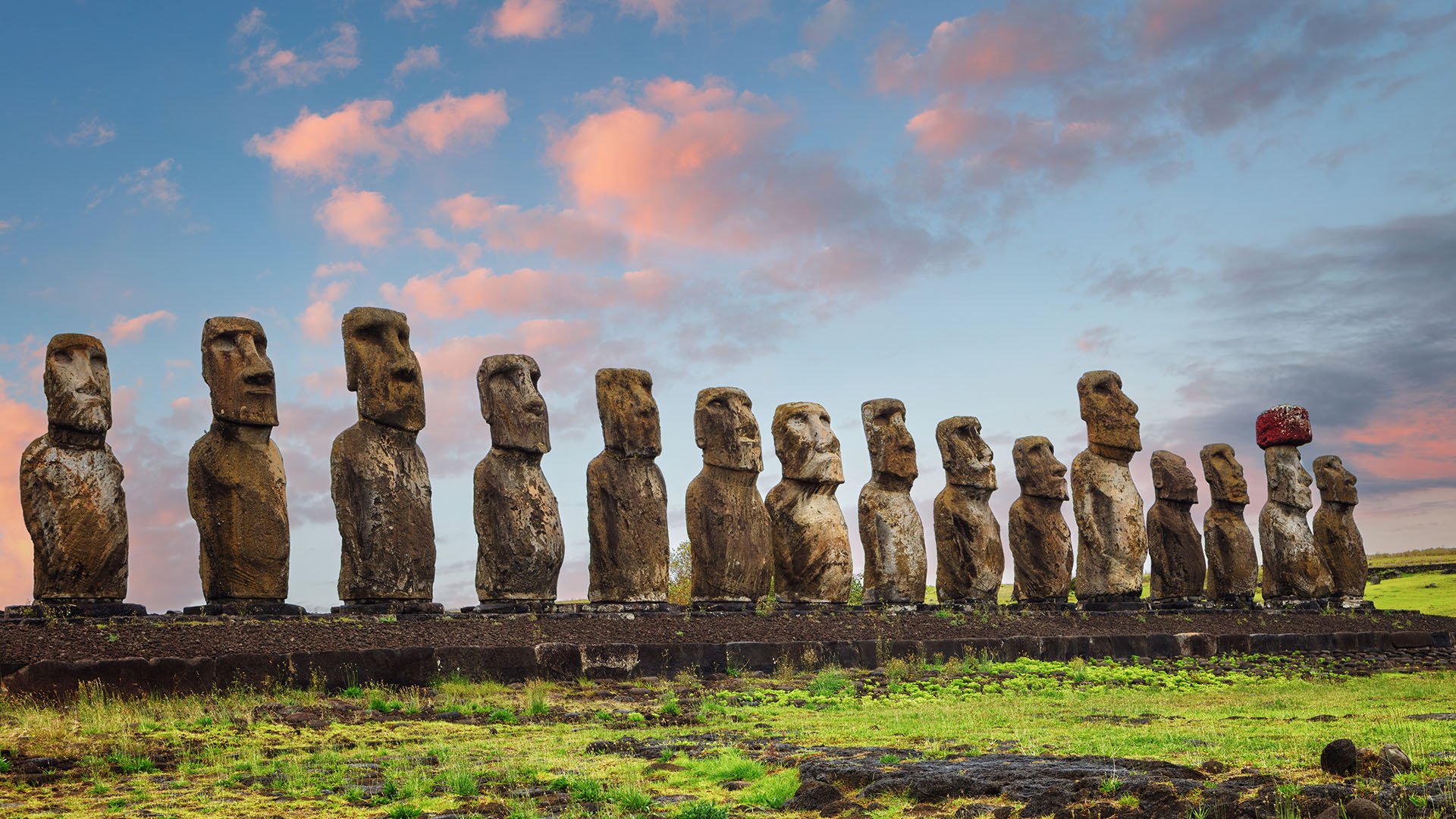 A group of moai statues at sunset on Rapa Nui/Easter Island.