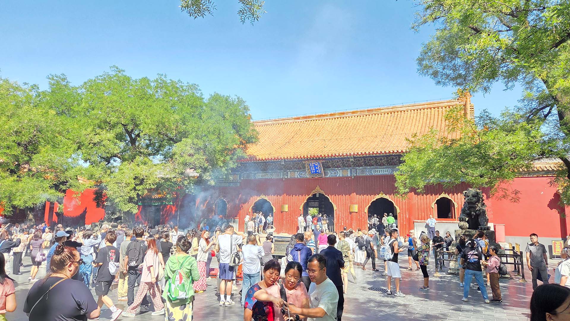 View of Chinese tourists visiting temples, including Lama Temple